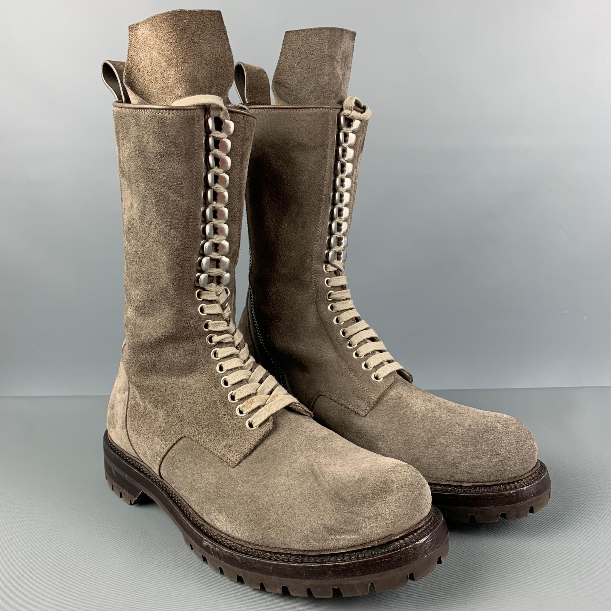RICK OWENS 'Army' mid-calf boots comes in a taupe suede featuring side zipper detail, round toe, gunmetal tone hardware, and a lace up closure. 

Very Good Pre-Owned Condition. Small mark at shoelace. As-Is.
Marked: 44

Measurements:

Length: 12.75