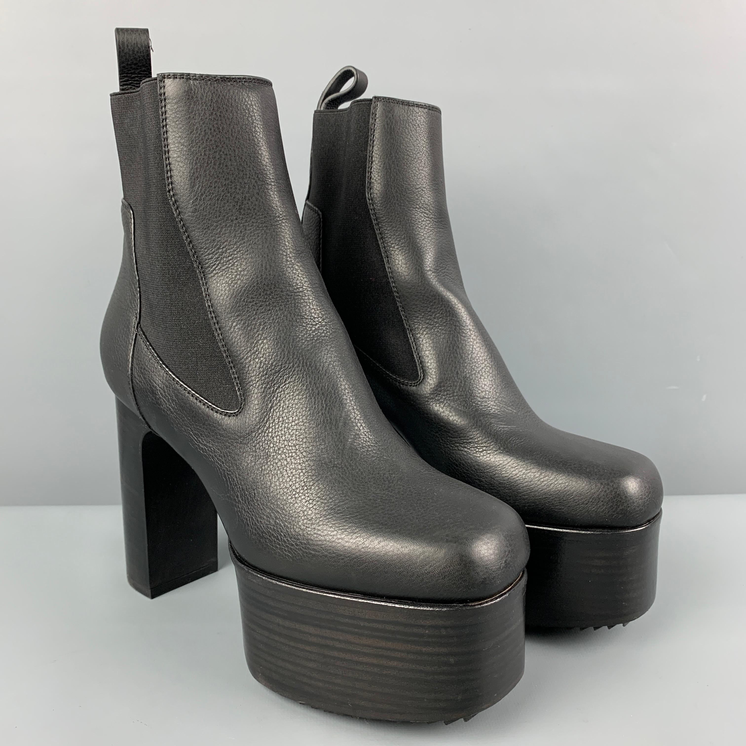 RICK OWENS '65mm' boots comes in a black leather featuring a platform style, chelsea style, and a chunky heel. Made in Italy. 

New without tags. 
Marked: 37.5
Original Retail Price: $1,460.00

Measurements:

Length: 9.5 in.
Width: 3.25 in.
Height: