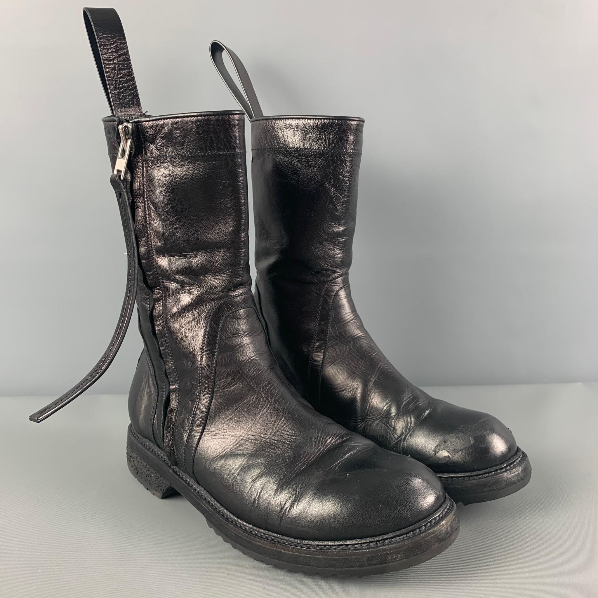 RICK OWENS boots comes in a black leather featuring a round toe, good flex sole, and a side zipper closure. Made in Italy.

Good Pre-Owned Condition. Moderate wear. As-is.
Marked: 38
Original Retail Price: $1,295.00

Measurements:

Length: 11