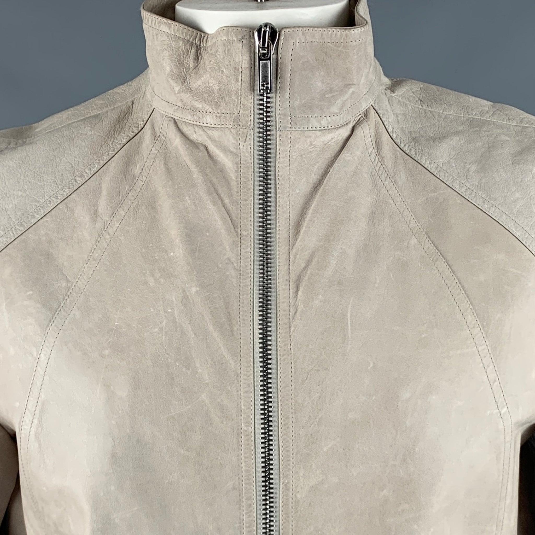 RICK OWENS 2016 jacket
in a grey kangaroo leather fabric featuring ribbed cuffs, and zip up closure. Made in Italy.Very Good Pre-Owned Condition. Minor signs of wear. 

Marked:   44 

Measurements: 
 
Shoulder: 16.5 inches Chest: 44 inches Sleeve: