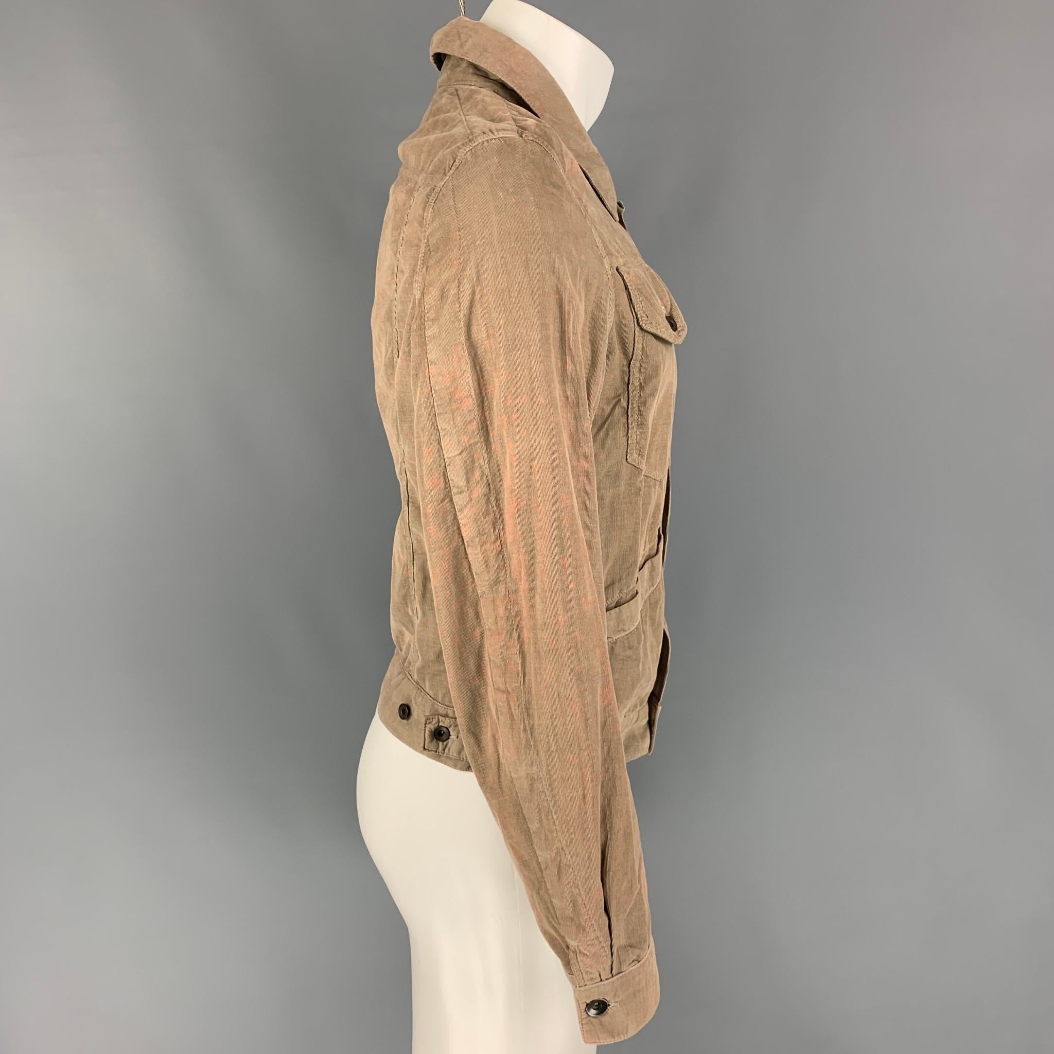 RICK OWENS jacket comes in a khaki cotton with distressed details featuring a trucker style, front pockets, and a buttoned closure. Made in Italy. 

Good Pre-Owned Condition.
Marked: M

Measurements:

Shoulder: 16.5 in.
Chest: 40 in.
Sleeve: 26.5