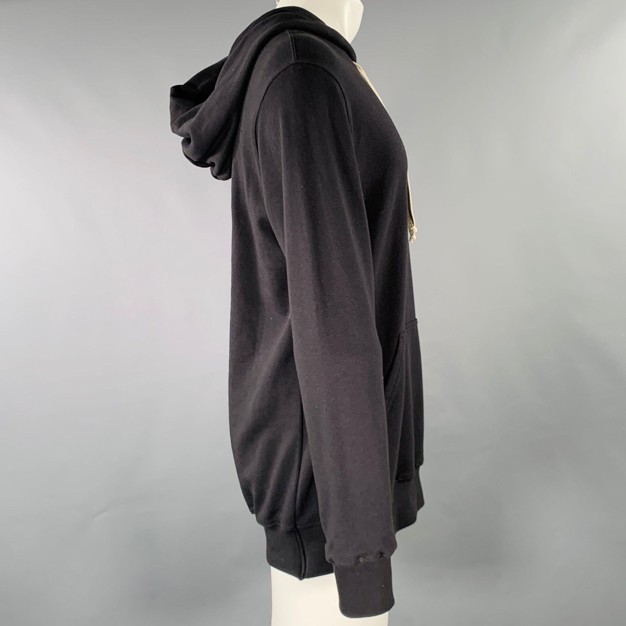 RICK OWENS x CHAMPION sweatshirt
in black cotton polyester blend fabric featuring a hooded style, black star collaboration logo on back, and kangaroo pocket. Made in Italy.Excellent Pre-Owned Condition. 

Marked:   S 

Measurements: 
 
Shoulder: 20