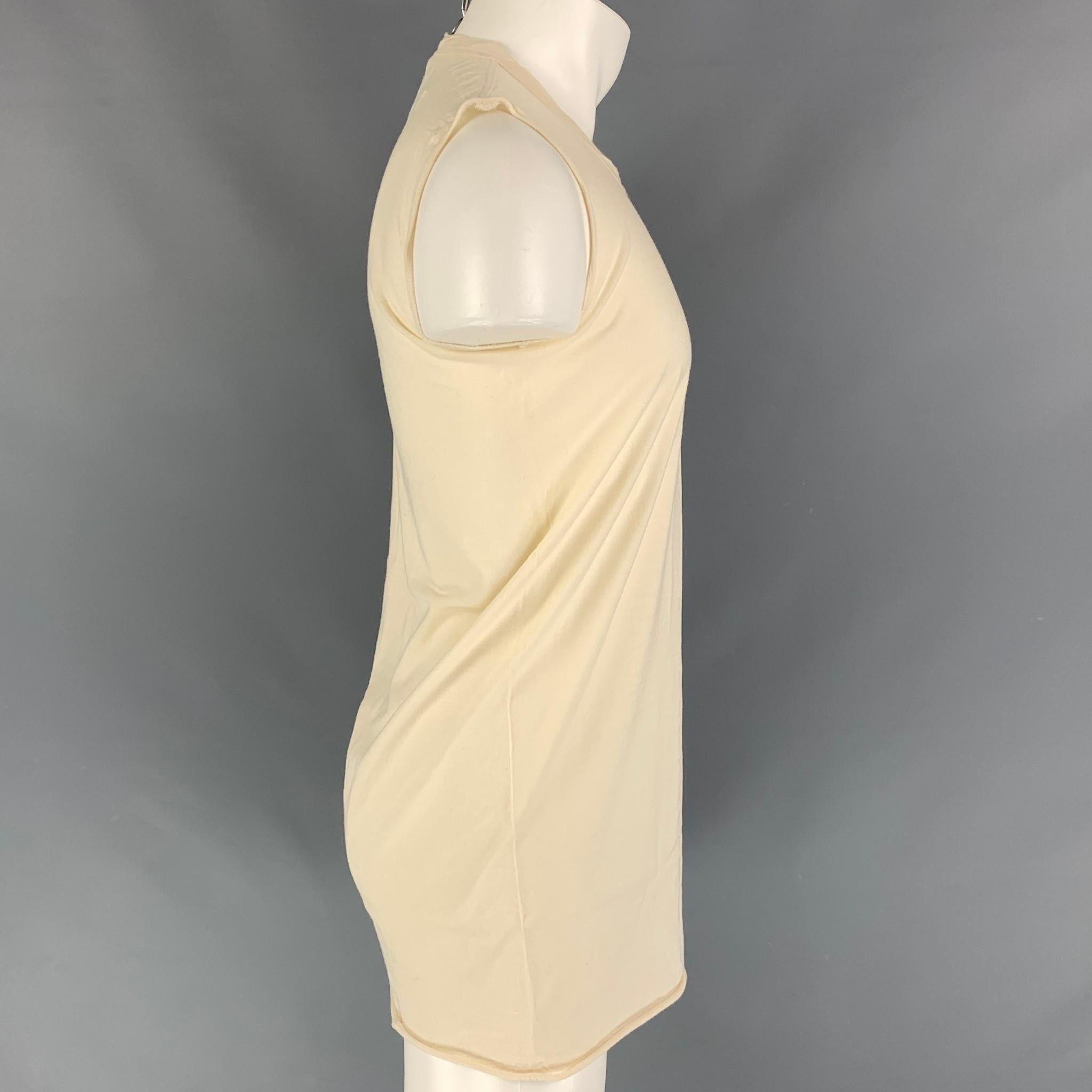 RICK OWENS FW 15 'SPHINX' long t-shirt comes in a beige material featuring a sleeveless style and a crew-neck. 

Very Good Pre-Owned Condition. Fabric tag removed.
Marked: Size tag removed.

Measurements:

Shoulder: 15 in.
Chest: 36 in.
Length: 32.5