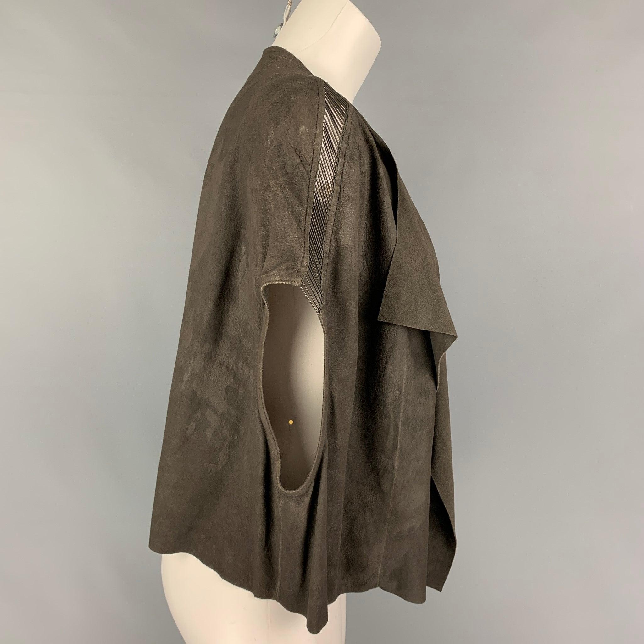 RICK OWENS 'DIRT' SS 18 vest comes in a grey suede featuring a draped style, shoulder metal embellishments, and a open front.Very Good
Pre-Owned Condition. Fabric tag removed.  

Marked:   Size tag removed 

Measurements: 
 
Shoulder: 23 inches 