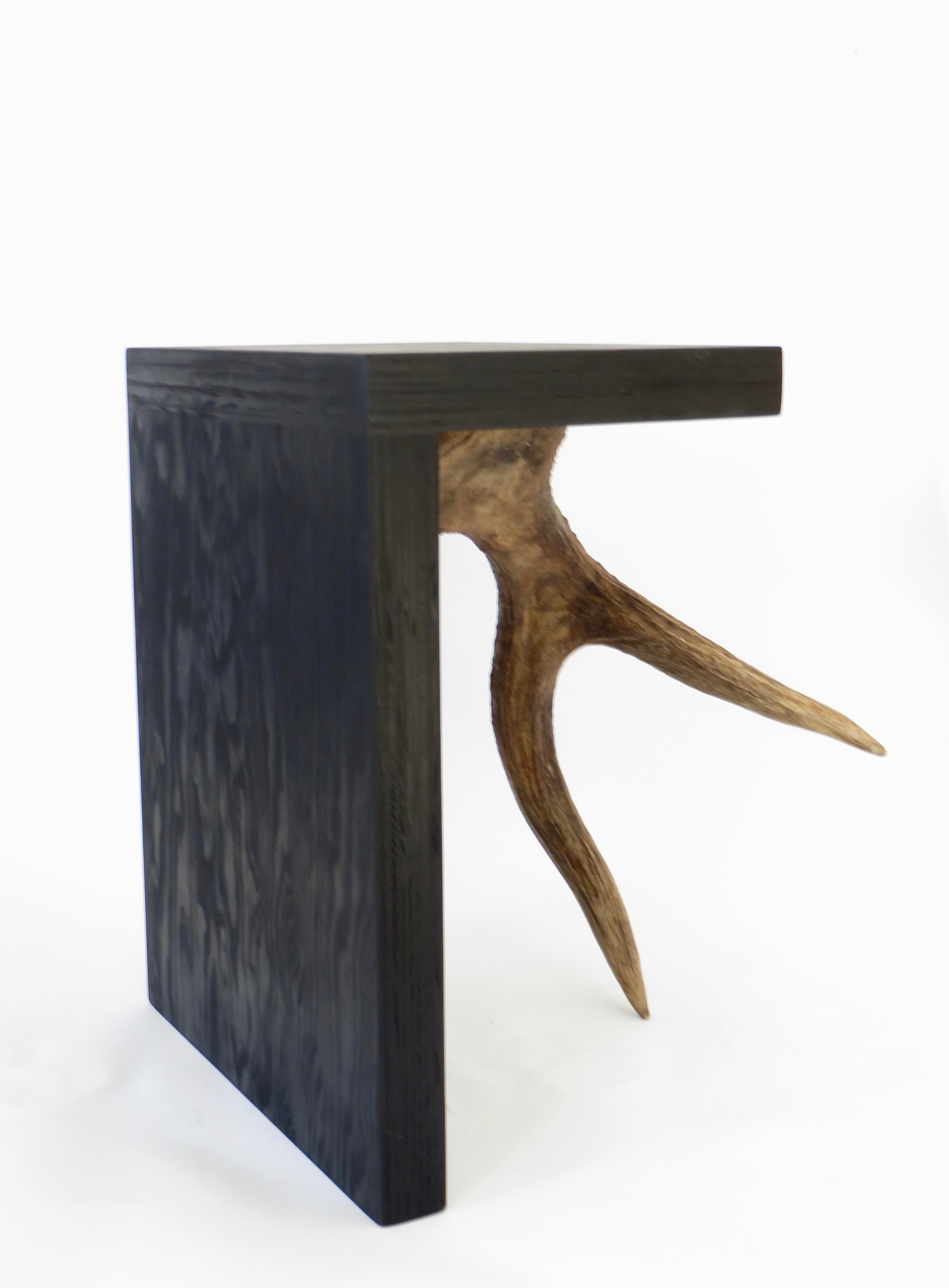 Black ebonized stained solid plywood forms with elk or moose antler.
Iconic Rick Owens use of natural and organic modern materials.
These are from the open edition series.
Each stool is signed on the base and is a piece unique. May be used as