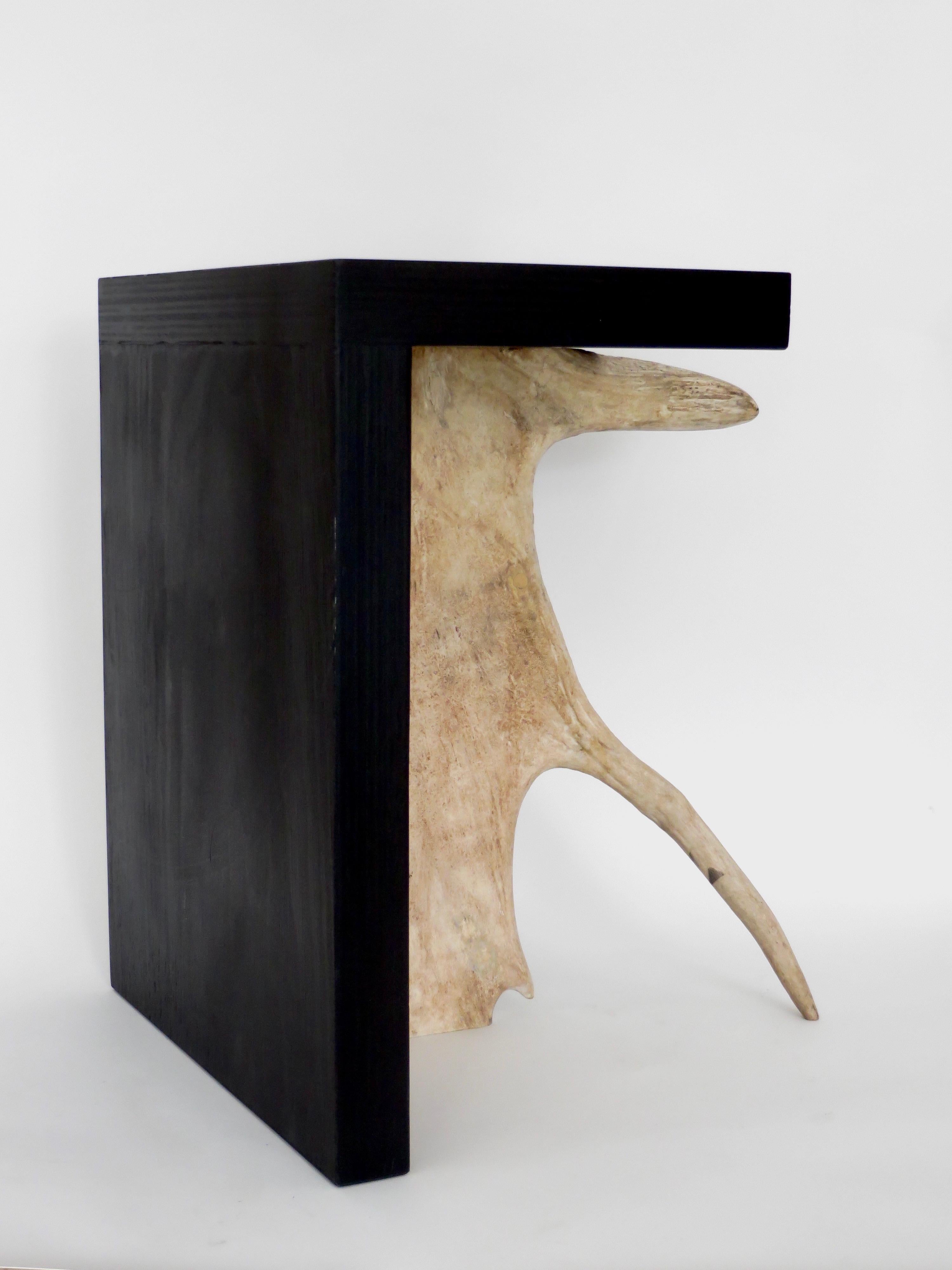 Black ebonized stained solid plywood forms with elk or moose antler.
Iconic Rick Owens use of natural and organic modern materials.
These are from the open edition series. 
Each stool is signed on the base and is a piece unique. 
May be used as