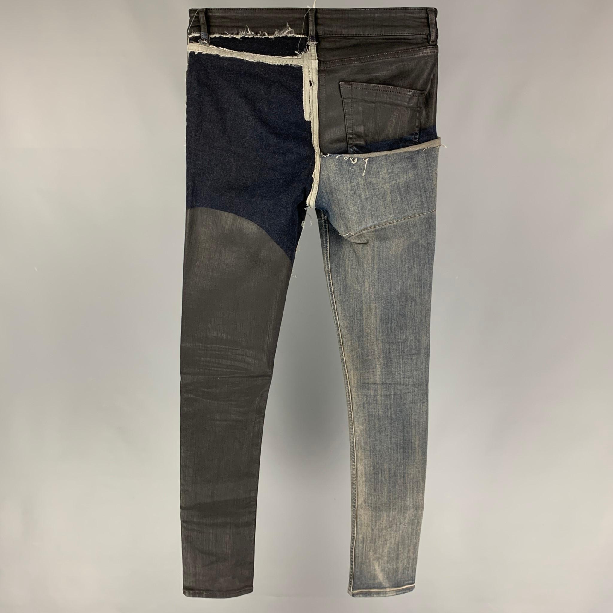 RICK OWENS 'Tyrone' SS 19 jeans comes in a blue denim with black waxed patchwork featuring a skinny fit, distressed, and a button fly closure. Made in Italy. 

Very Good Pre-Owned Condition.
Marked: 30

Measurements:

Waist: 30 in.
Rise: 10