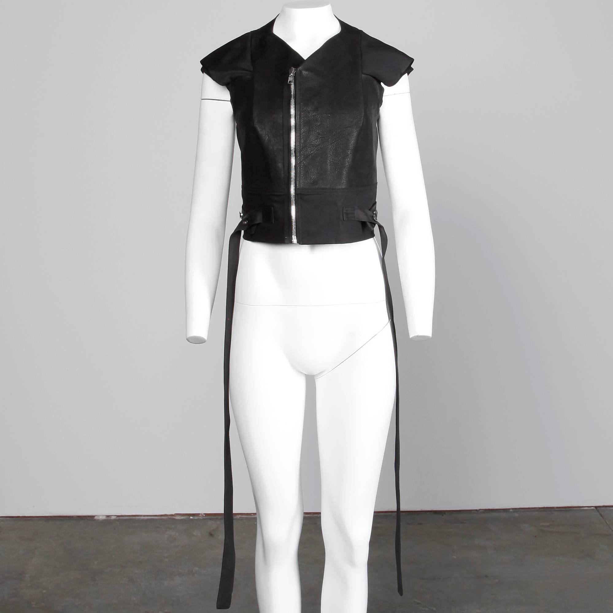 Unworn with the original tags still attached from S/S 2015! Rick Owens leather jacket or vest with unique sleeves and asymmetric zipper. Fully lined with front zip closure. 100% calf leather, 97% cotton, 3% spandex. The marked size is I 44/ GB 12/