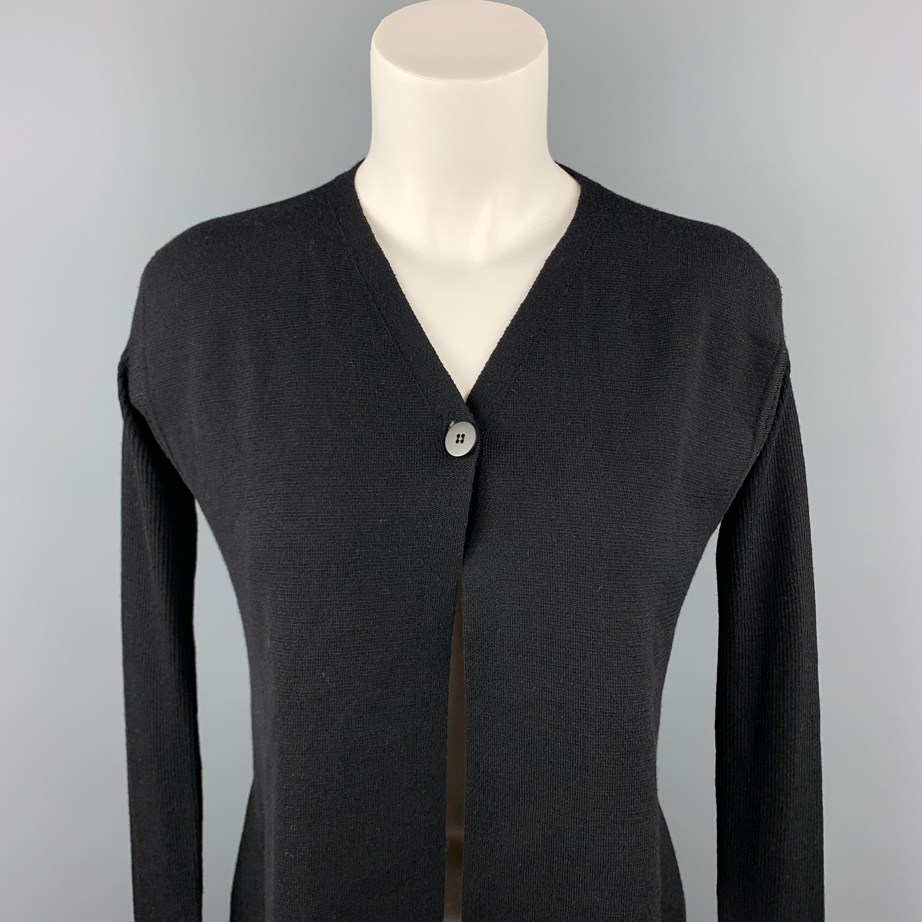 RICK OWENS VICIOUS S/S 14 cardigan comes in a black knitted virgin wool featuring an asymmetrical and a single button closure. Made in Italy.

Very Good Pre-Owned Condition.
Marked: M

Measurements:

Shoulder: 17 in. 
Bust: 34 in. 
Sleeve: 32 in.