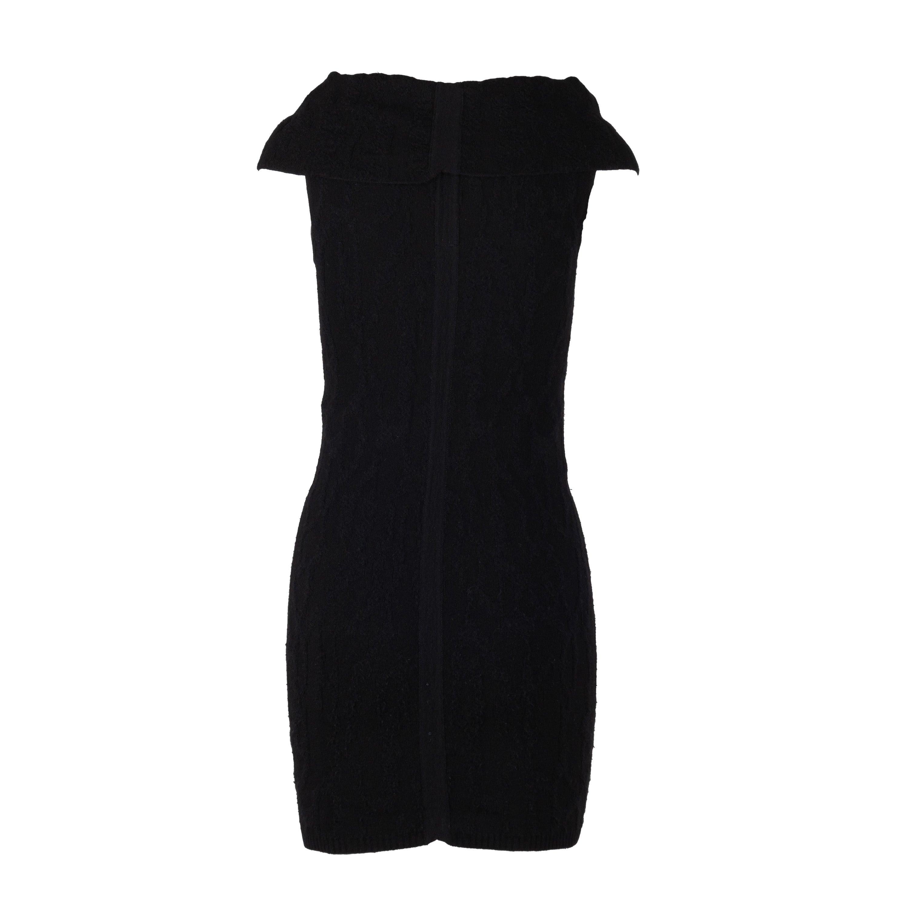 This Rick Owens Wool Shift Dress features a sleek, knitted top in black with a longline hem for a slim, fluid silhouette. Designed in the AW10 collection, it can be styled as a cowl neck to create a chic and unique look.
 Remarks: There is no size