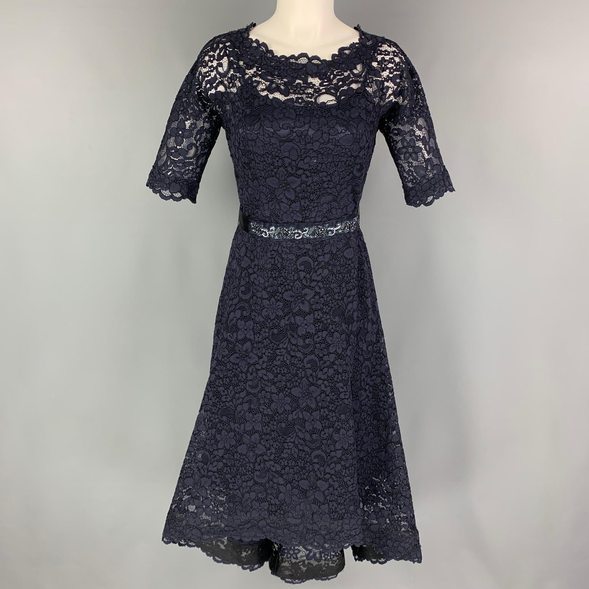 RICKIE FREEMAN for TERI JON dress comes in a navy lace cotton blend with a removable liner featuring an asymmetrical hem, belted rhinestone detail, and a back zip up closure. 

Very Good Pre-Owned Condition.
Marked: 2

Measurements:

Shoulder: 15
