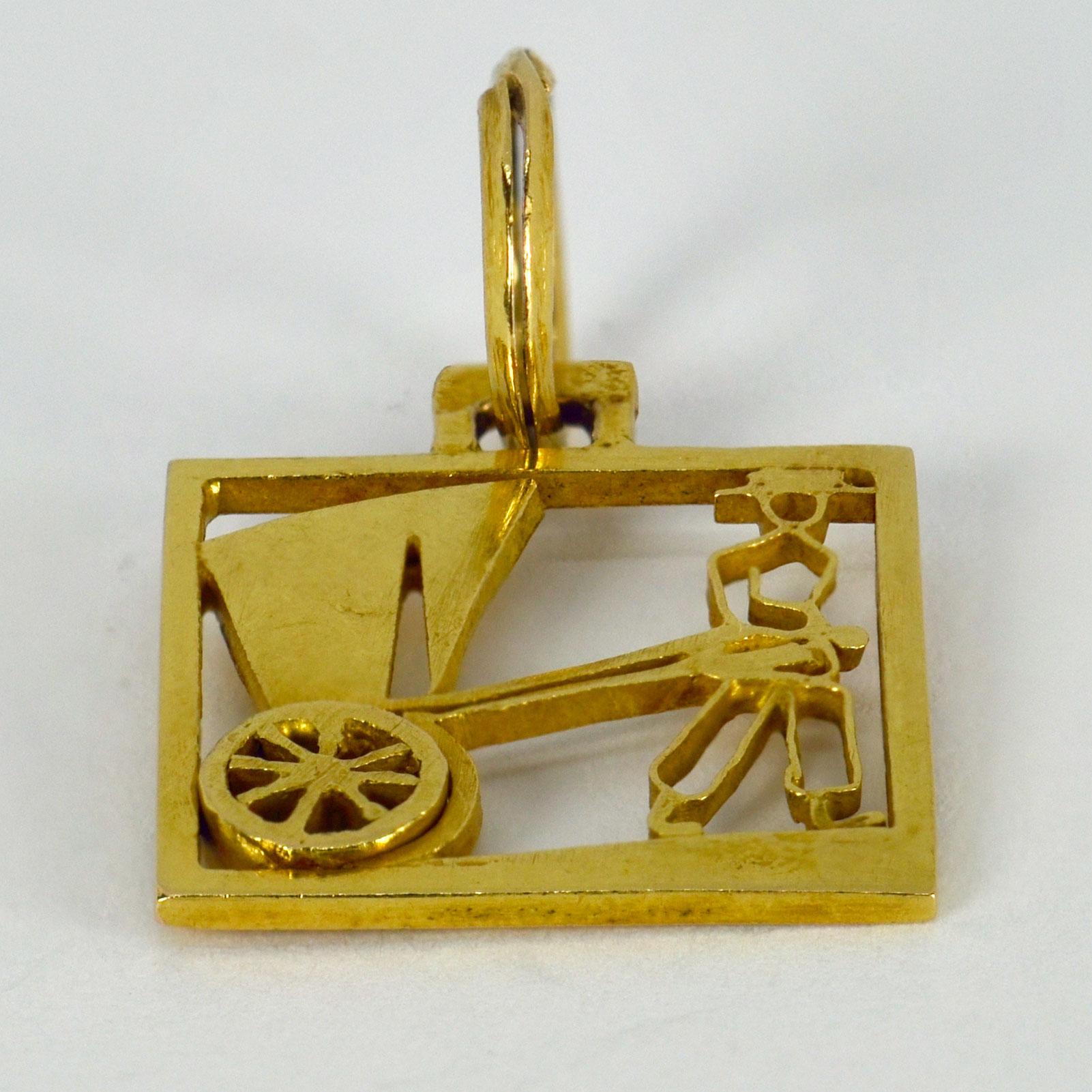 An 18 karat (18K)  yellow gold square charm pendant designed as a rickshaw. Stamped with the owl mark for French import and 18 karat gold.

Dimensions: 1.8 x 1.5 x 0.15 cm (not including jump ring)
Weight: 2.09 grams
