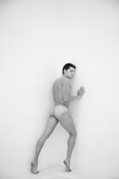 Man against wall, One. Motion Series. Male Nude. Black and White Photograph