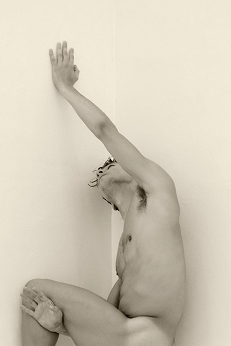 Man against wall, Two. Motion Series. Male Nude Sepia Photograph - Beige Black and White Photograph by Ricky Cohete