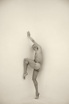 Man against wall, Two. Motion Series. Male Nude Sepia Photograph
