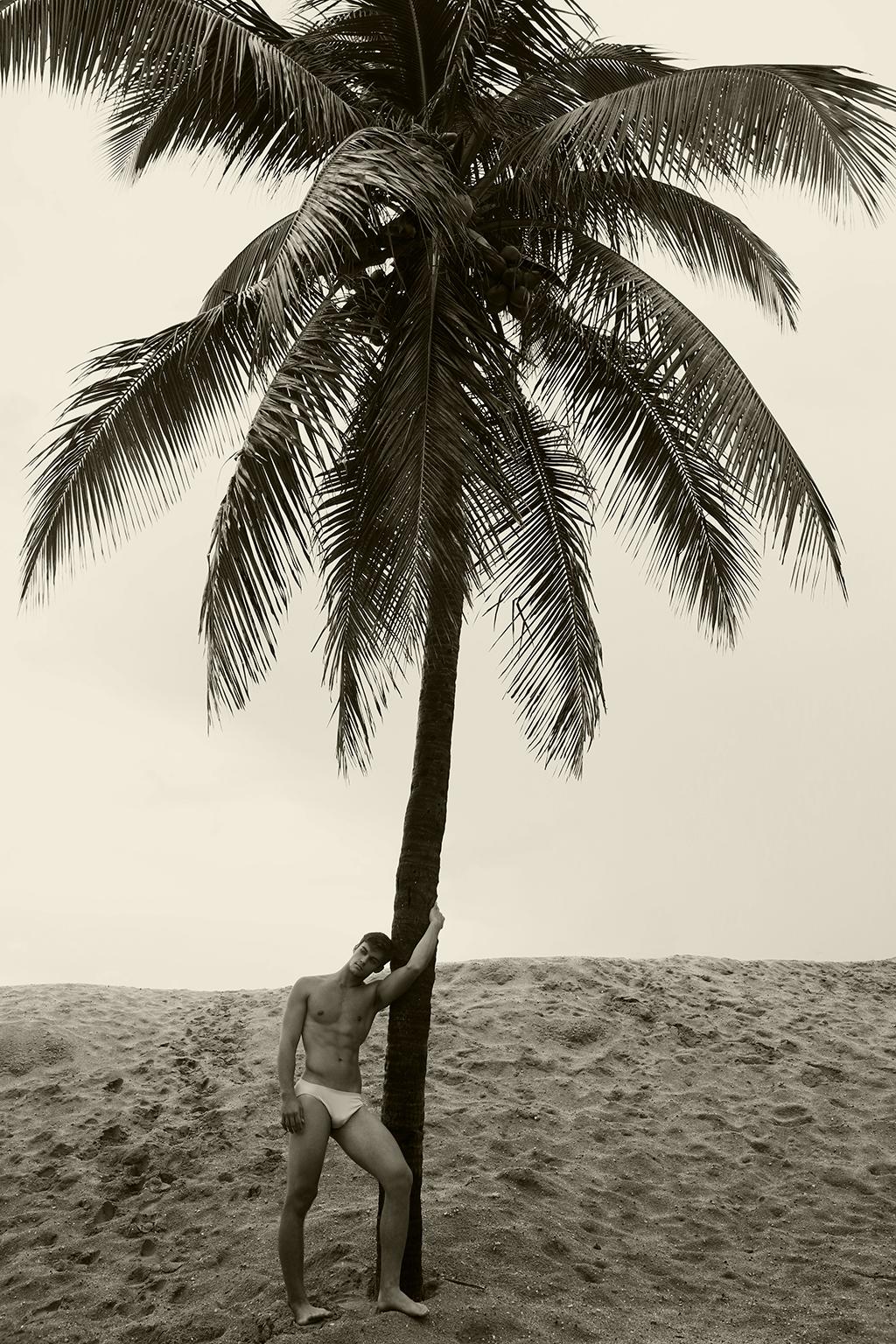 Ricky Cohete Black and White Photograph - Men & Palm, Tree. Sepia. Limited Edition Photograph