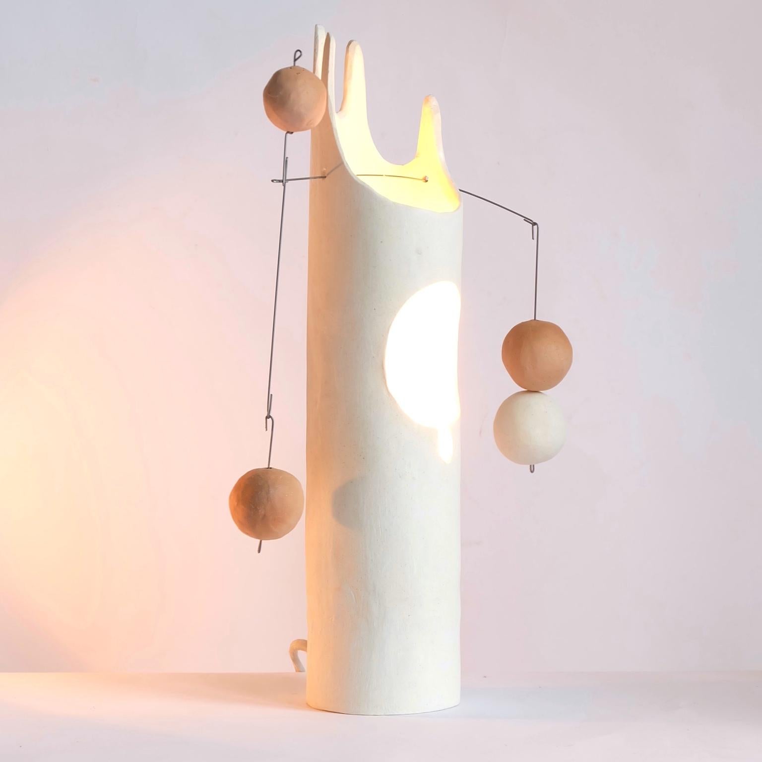 Mico’s Cousin Rico is a contemporary hand-built sculptural ceramic table lamp that inspires the joy of working with hands through unpacking, assembling and balancing weights. The handmade ceramic globes and the hanging steel wire come fit right