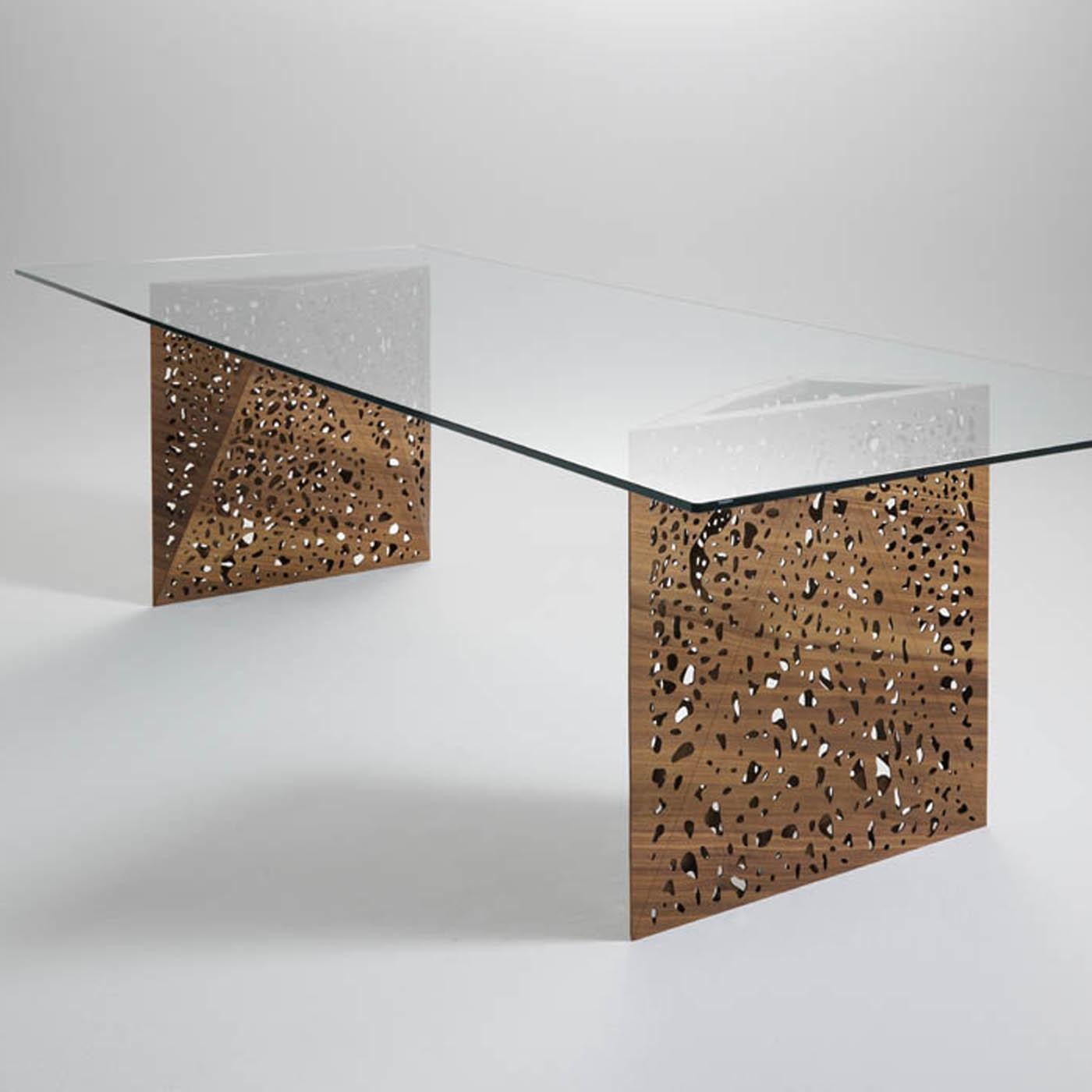 Outstanding elements of this stunning and sculptural dining table are the origami-inspired legs which testify to its meticulous craftsmanship and innovative allure. In this design Steven Holl recreates the concept of porosity that he favors in most