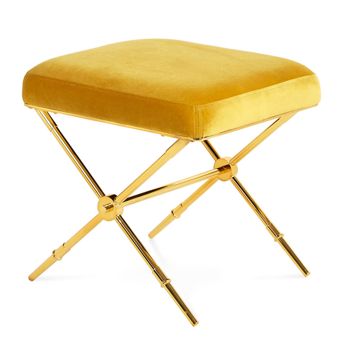 Golden glow. Our updated take on Empire style, the Rider Bench doubles as a tiny table when topped with a tray. An embroidered plush velvet seat on sabot-detailed legs. Gleaming brass with golden velvet upholstery—luxe and surreal all at once. Fab