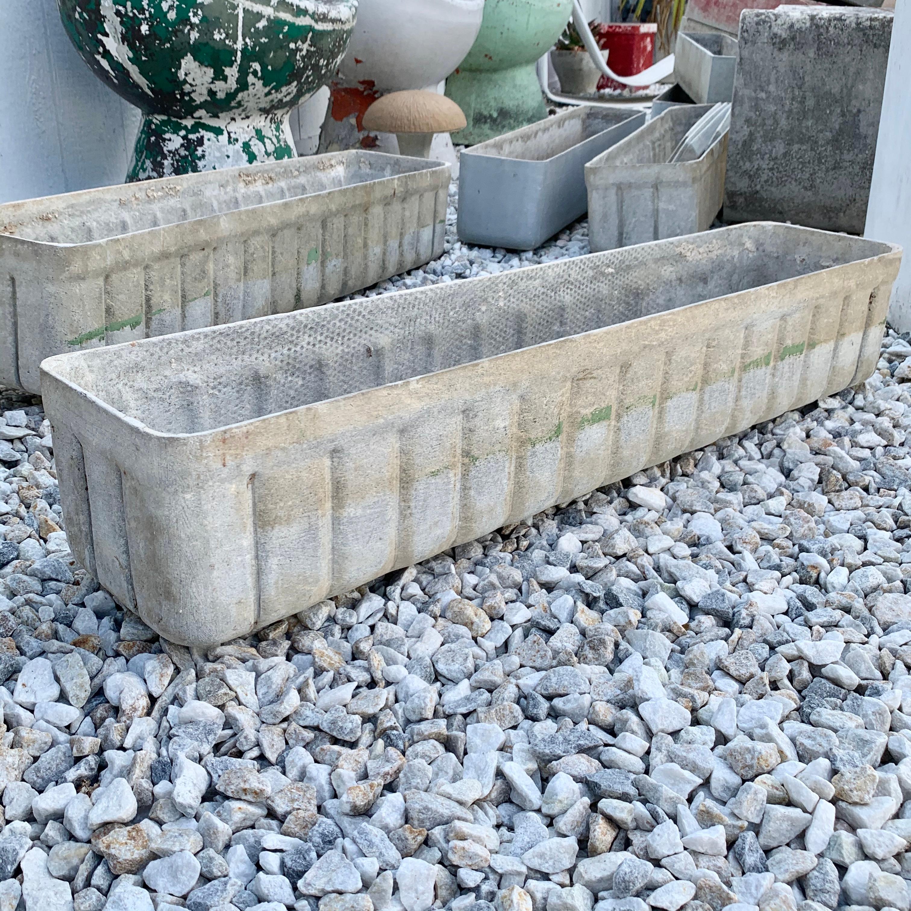 Fantastic rectangular planter by Swiss architect Willy Guhl for Eternit. Ridge design on all sides. Just under 3.5 feet long. Great lines and clean design. Good vintage condition and patina. Two factory drilled holes for draining. Factory