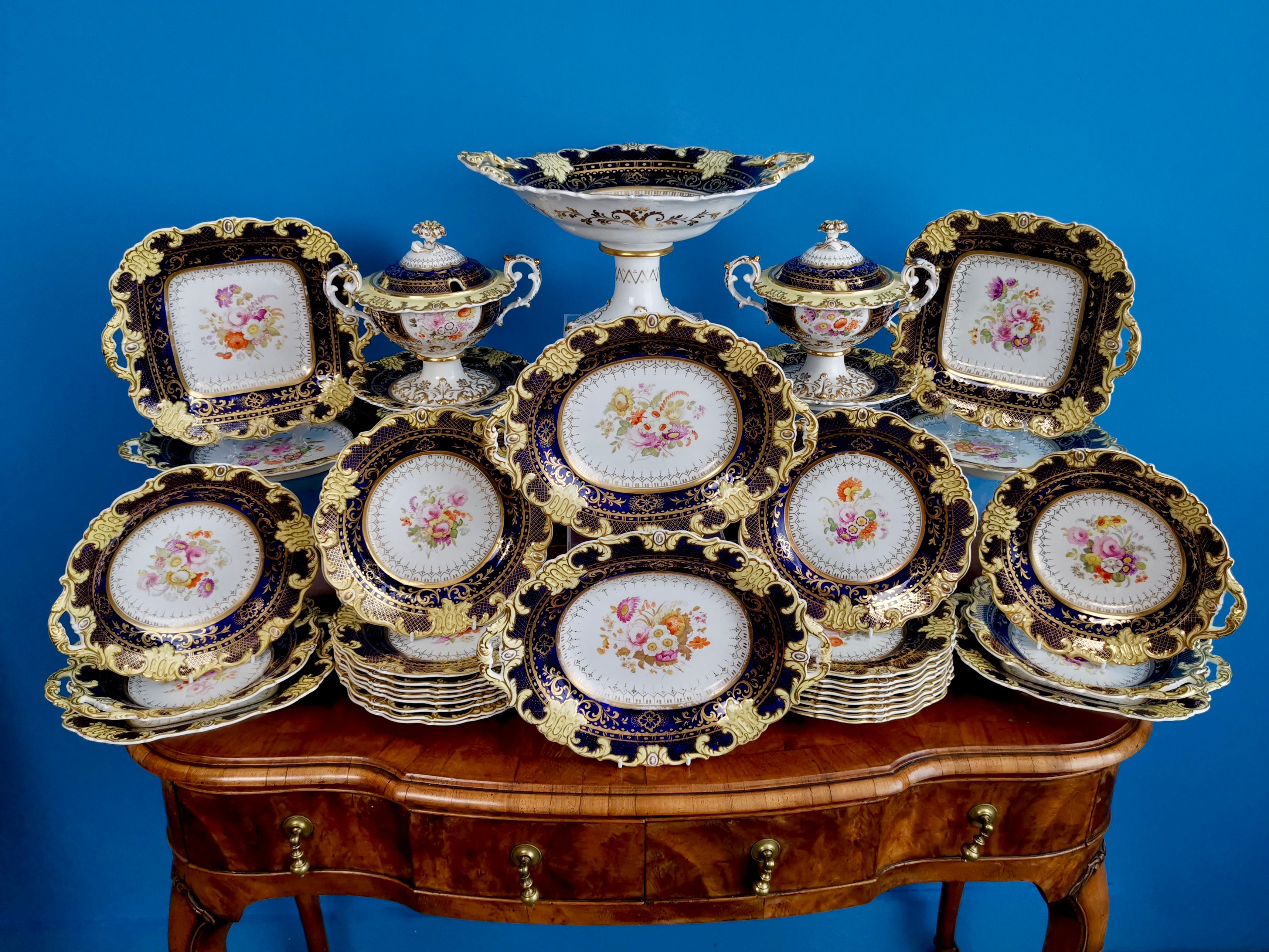 This is a stunning full 35-piece dessert service made by Ridgway circa 1825, which is known as the Regency period. The service consists of eighteen plates, four oval dishes, four square dishes, four one-handled dishes, two lidded sauce comports on