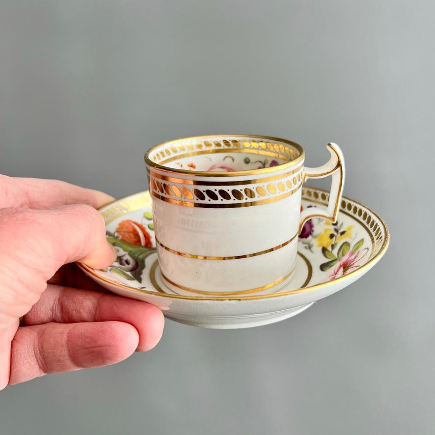 This is a beautiful coffee can and saucer made around 1815 by Ridgway. It is made of fine white bone china in the 