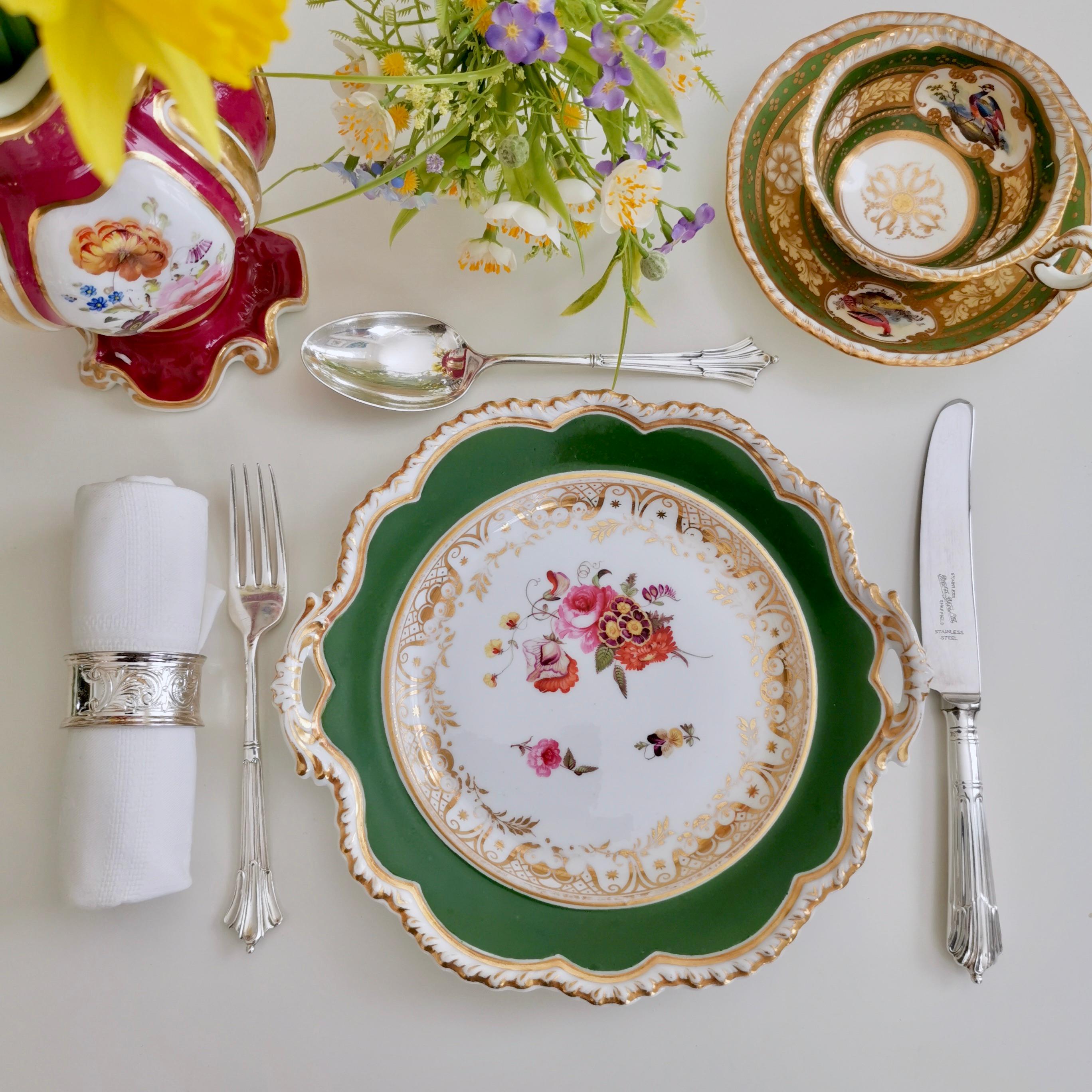 This is a very beautiful dessert plate made by Ridgway around 1825, which is known as the Regency period. The plate has a deep green ground and hand painted flowers, and would have formed part of a large dessert service.

Ridgway was one of the