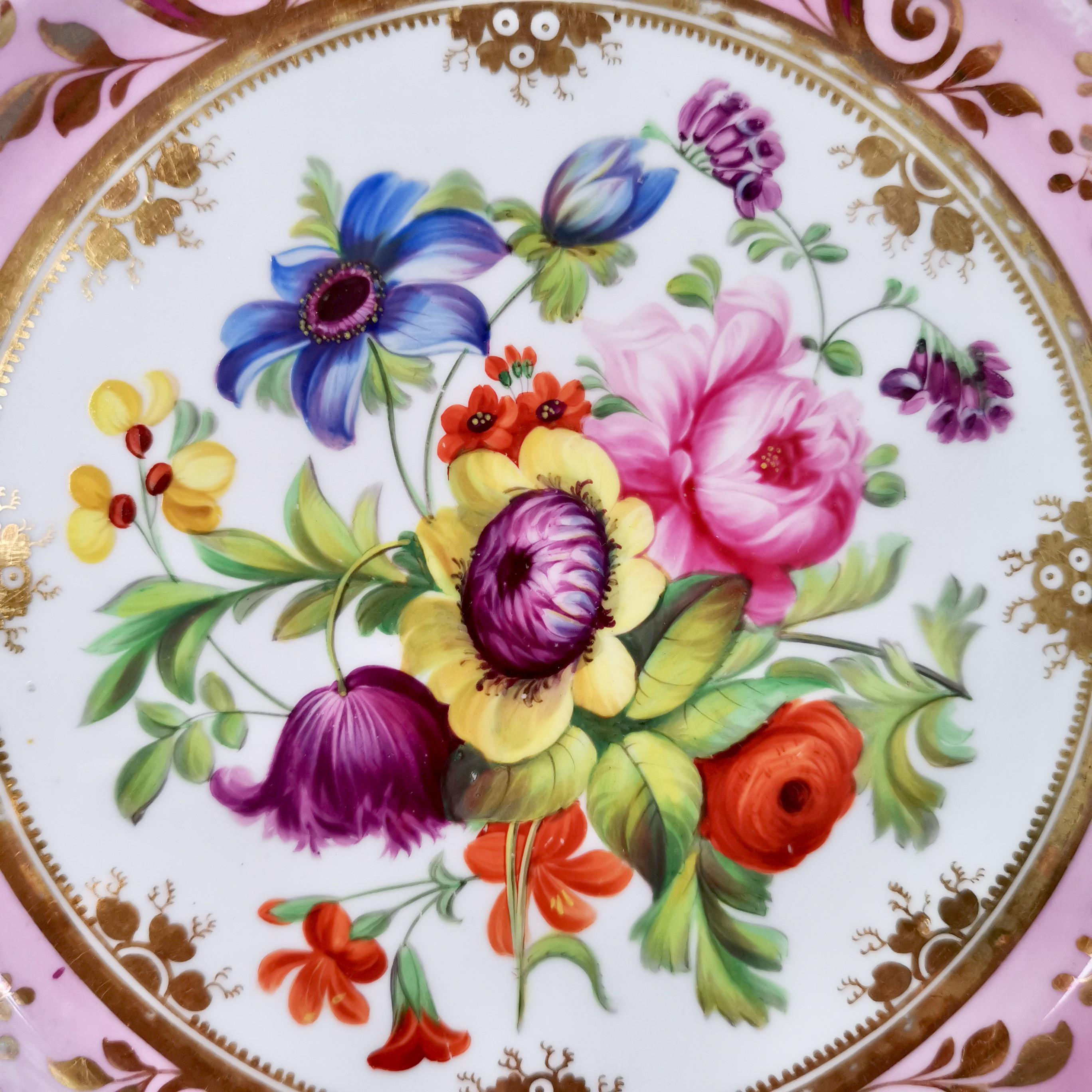 This is a stunning plate made by Ridgway around 1829. The plate has a wonderful mauve and pink ground with a rich choice of hand painted flowers in the centre. 
 
Ridgway was one of the pioneers of English china production alongside other great