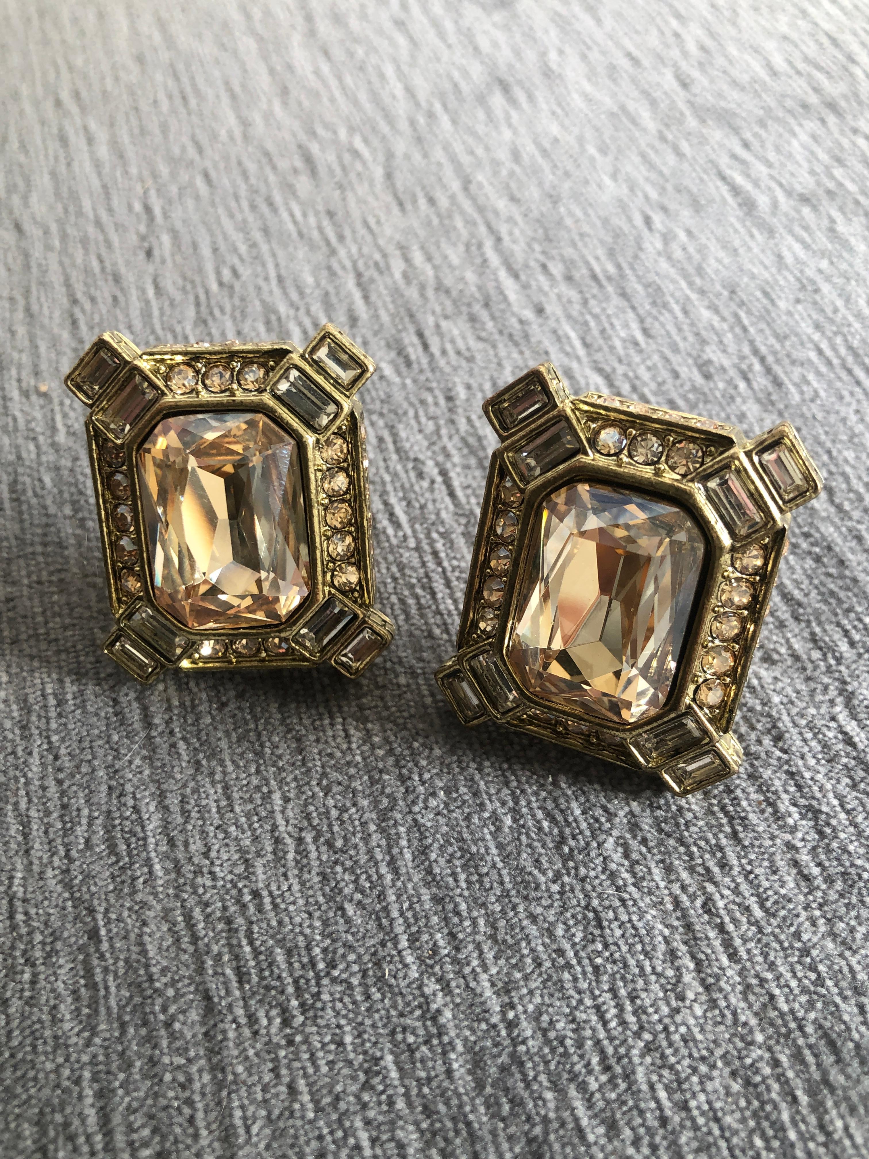 So, so intricate and beautifully made! Designed by style maven Heidi Dause. Antique gold blacted with the most beautiful large center champagne color crstal framed in baugette and round rhinestones. Lever back pierced. 