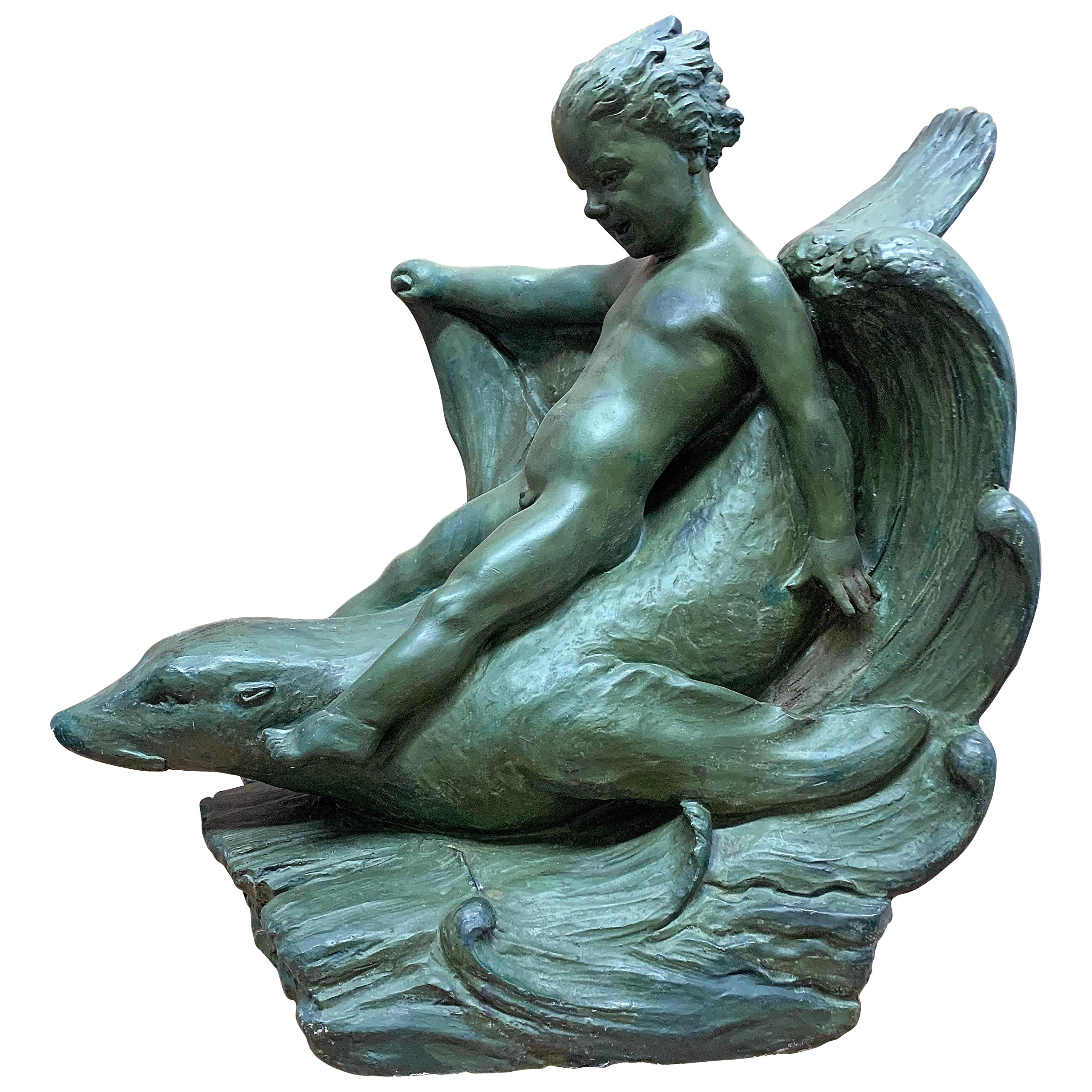 "Cavalcando le onde", grande e gioiosa scultura Art Déco di ragazzo che cavalca una foca