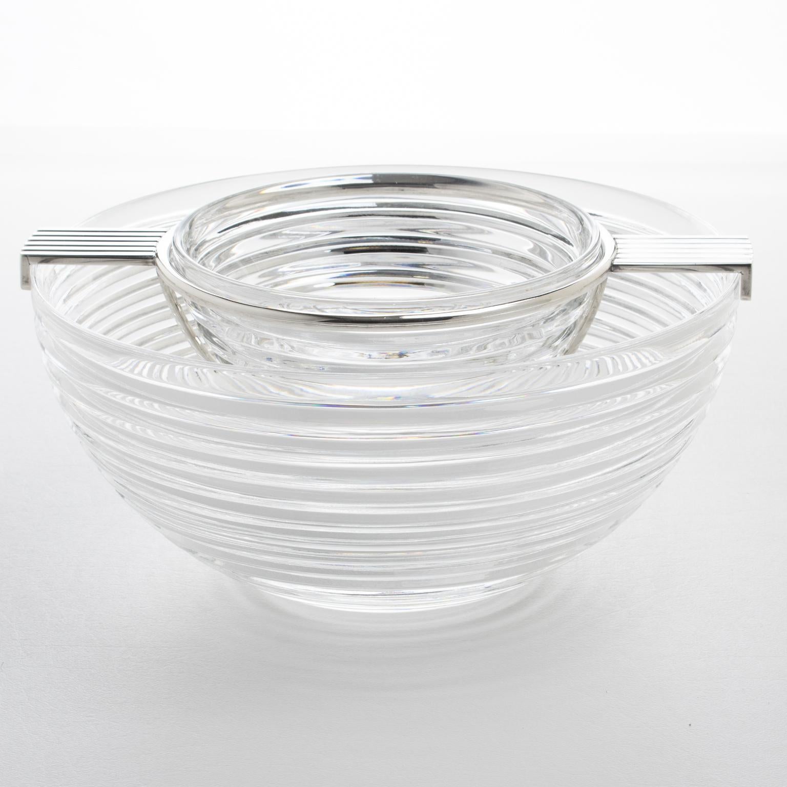 This elegant caviar serving bowl or dish from Riedel's Mesa collection was crafted in Italy during the 1980s. Its sleek modernist design showcases a geometric shape with a stunning stepped crystal container, complemented by a silver plate metal