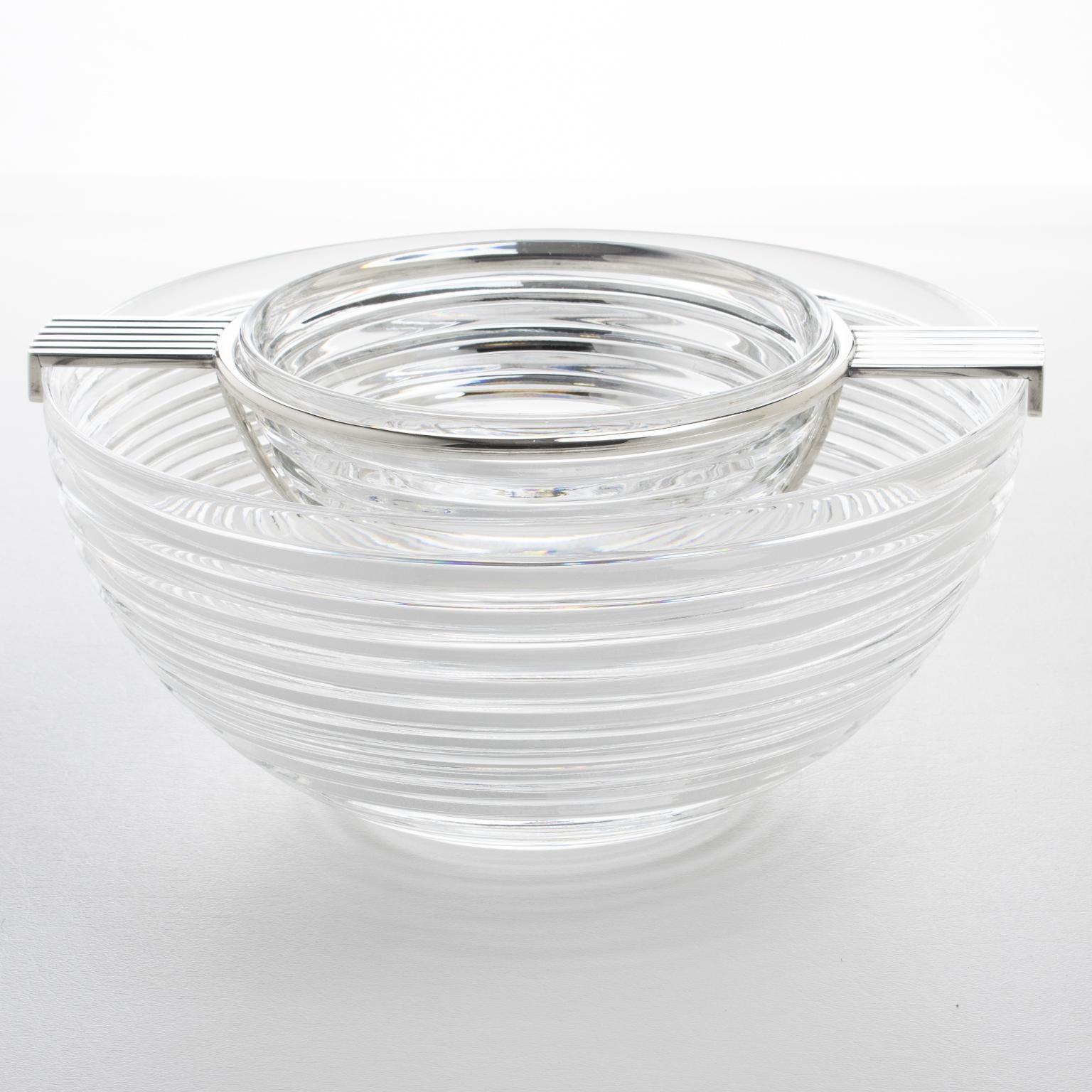 This elegant caviar serving bowl or dish from Riedel's Mesa collection was crafted in Italy, circa 1980. Its sleek modernist design showcases a geometric shape with a stunning stepped crystal container, complemented by a silver plate metal holder