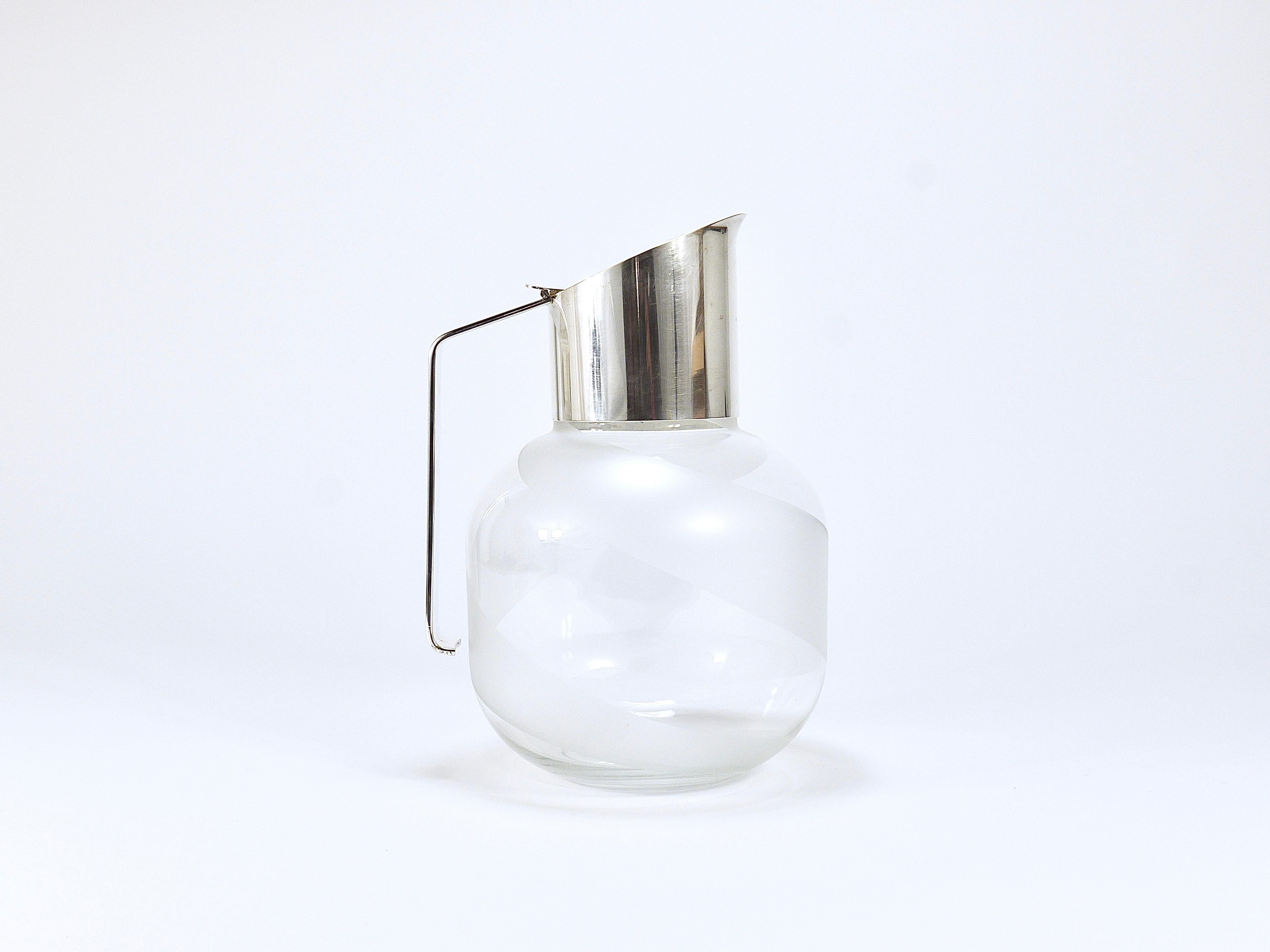 A beautiful premium-quality crystal glass and silver-plated carafe / pitcher or wine decanter. This elegant piece is part of the Riedel Mesa Collection, a collaboration between Claus Joseph Riedel from Austria and Mesa Design from Italy, produced