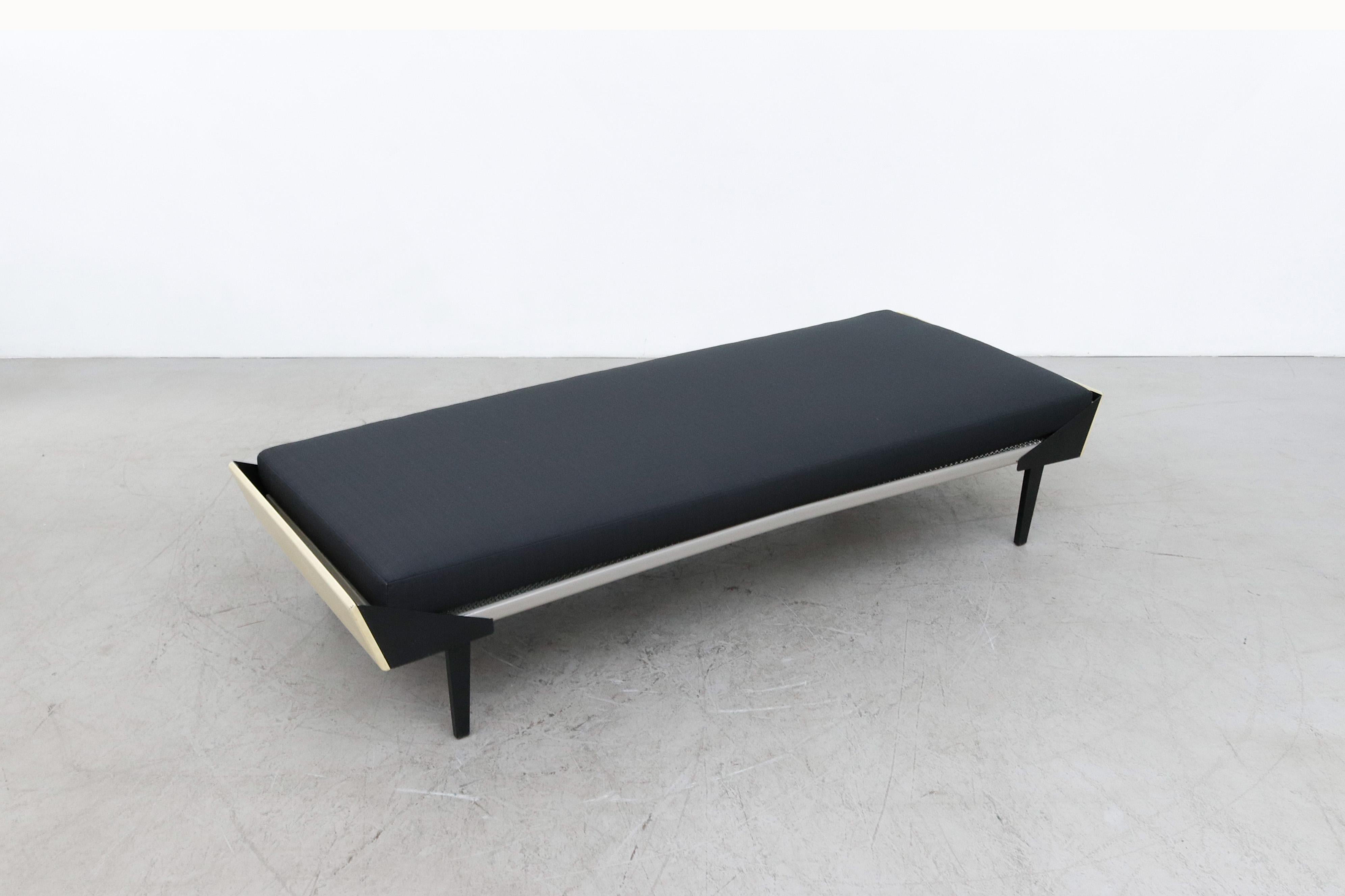 Mid-20th Century Rietveld Style Light Yellow Stained Wood and Black Enameled Daybed with Mattress For Sale