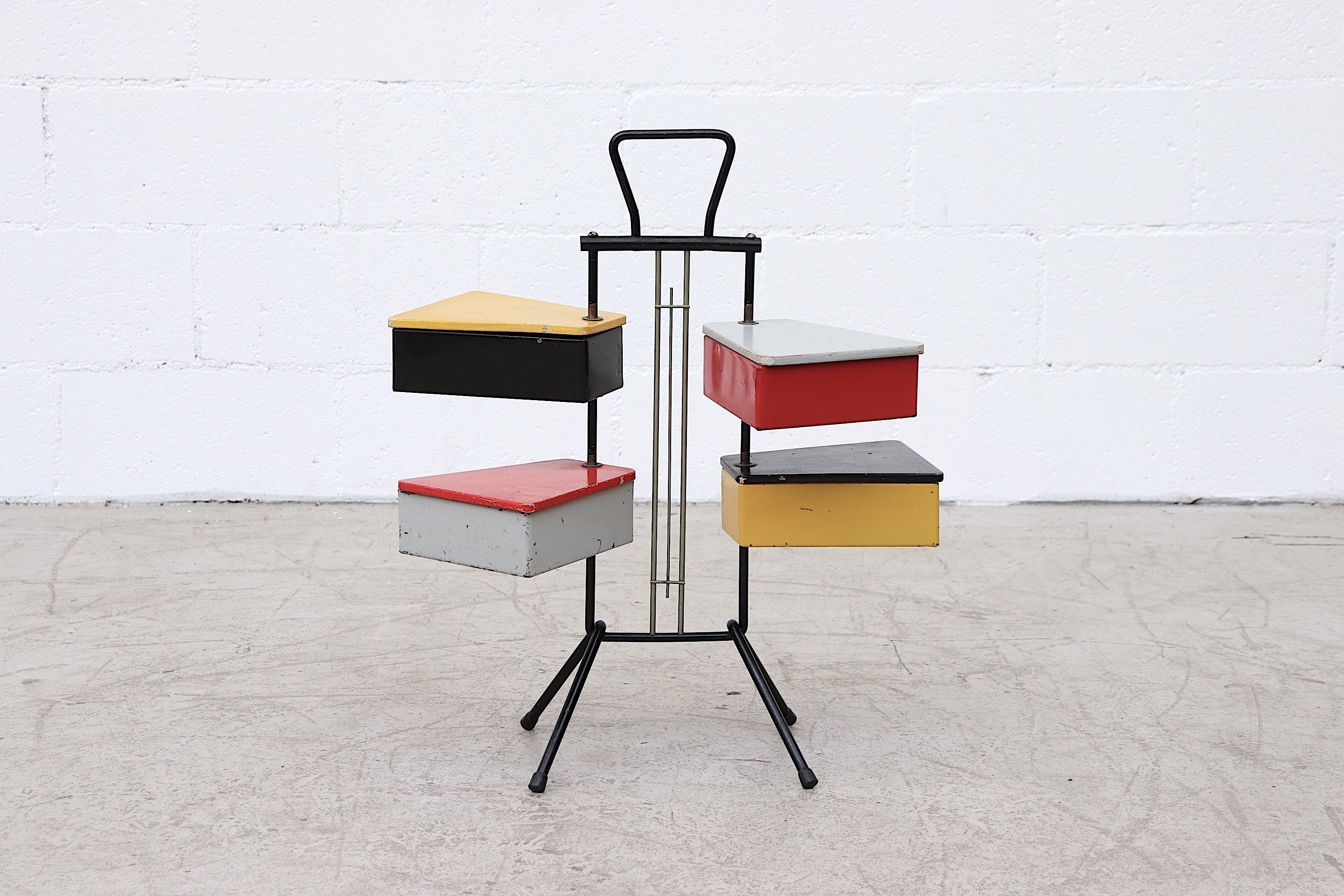 Colorful Rietveld style, 1950s sewing stand by Joos Teders for Metalux, black metal tripod stand, with Chrome accents and colored metal boxes with colored plywood lids. Both lacquered metal containers and lids swivel around the metal stand. Visibly