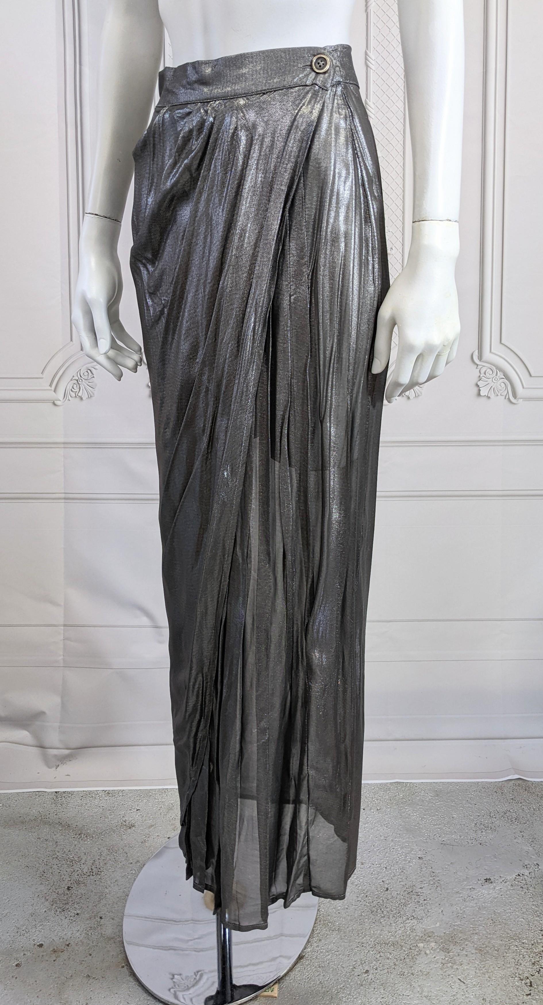Rifat Ozbek Liquid Lame Wrap Skirt from the 1980's designed with a finely pleated underlayer with a draped overlay similar to a sari in effect. Simple wrap style with 2 antique metallic pewter buttons. The sheer lame is like liquid platinum metal.