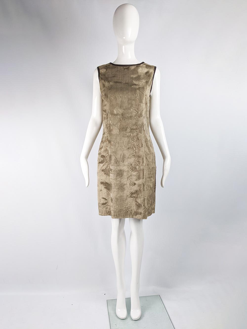 A fabulous vintage womens dress from the 90s by luxury fashion designer, Rifat Ozbek for the Future Ozbek line. In a short pile fake fur, which gives a 60s inspired feel which is furthered by the sleeveless, shift silhouette. Perfect for a party or
