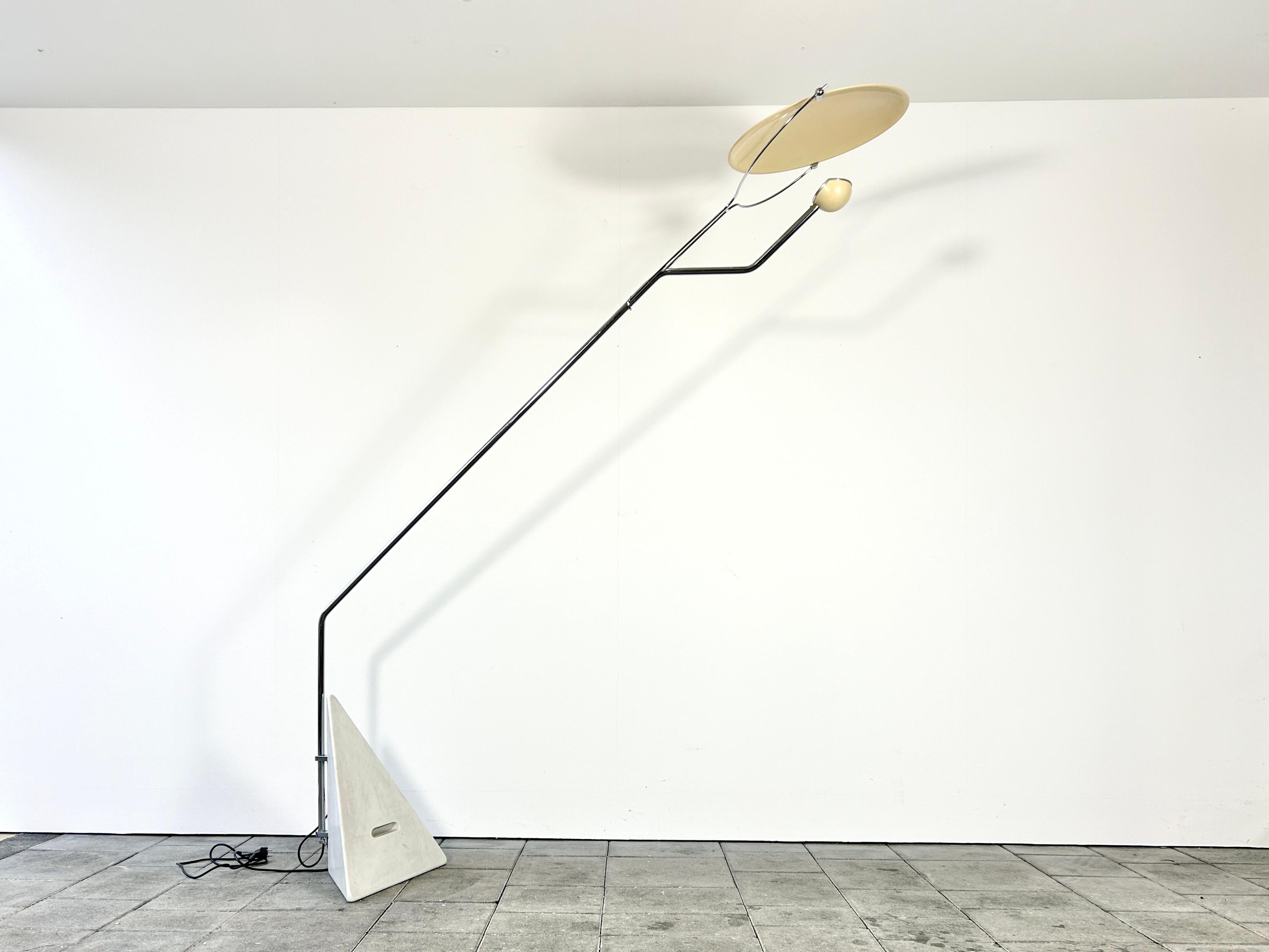Reflessione floor lamp designed by Claudio  in 1973.

manufactured by Skipper, Italy in the 1970ies. 

This collectible lamp is no longer in production. 

The Riflessione floor lamp by Claudio Salocchi has a triangular marble base, a chromed tubular