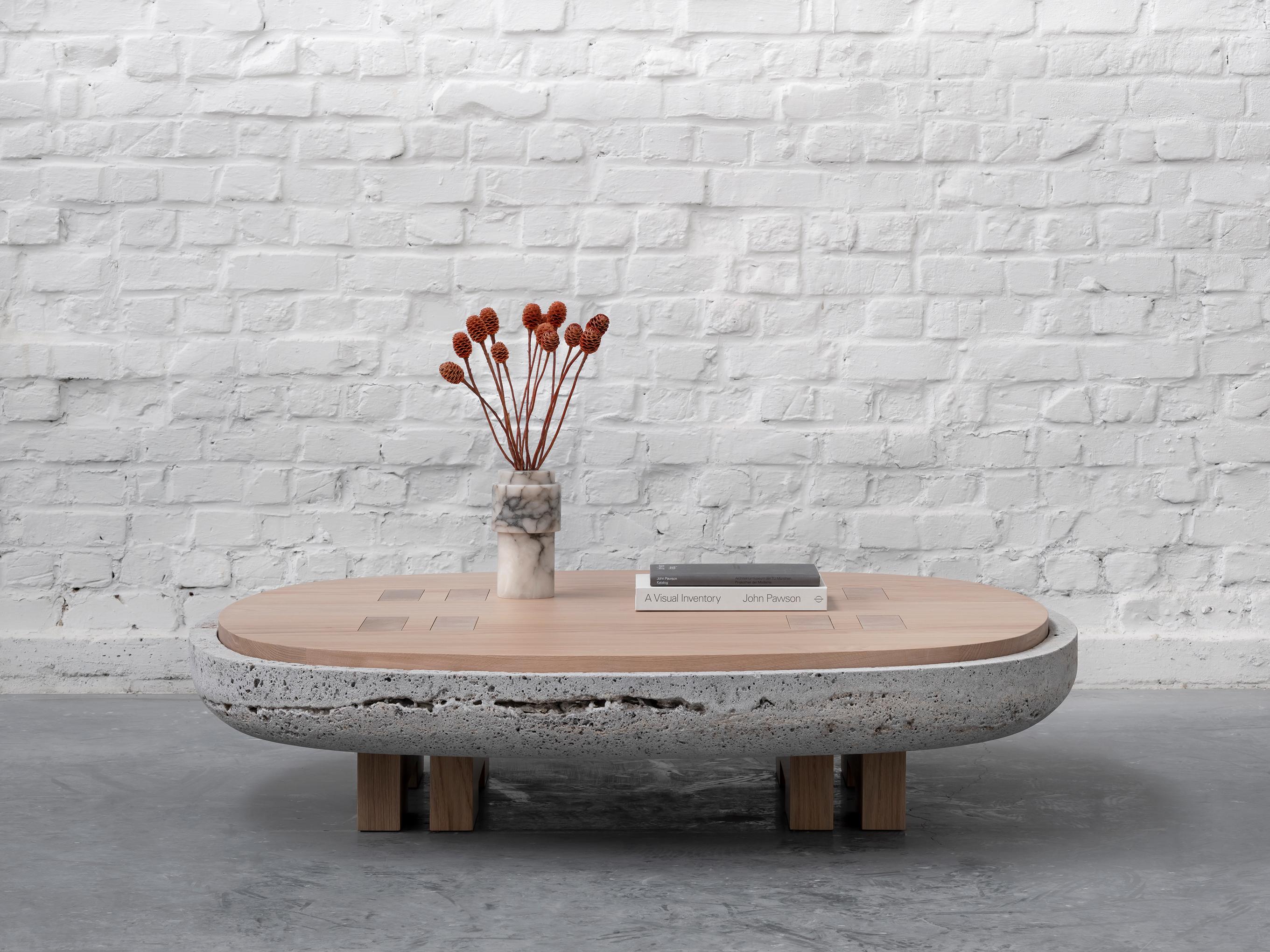 Rift coffee table stone by Andy Kerstens
Dimensions: 108 x 108 x 28cm
Materials: Travertino silver, bleached oak, stone, metal patinated bronze
Other types of wood and sizes available, White washed European Larch, Bleached European Oak, Dark