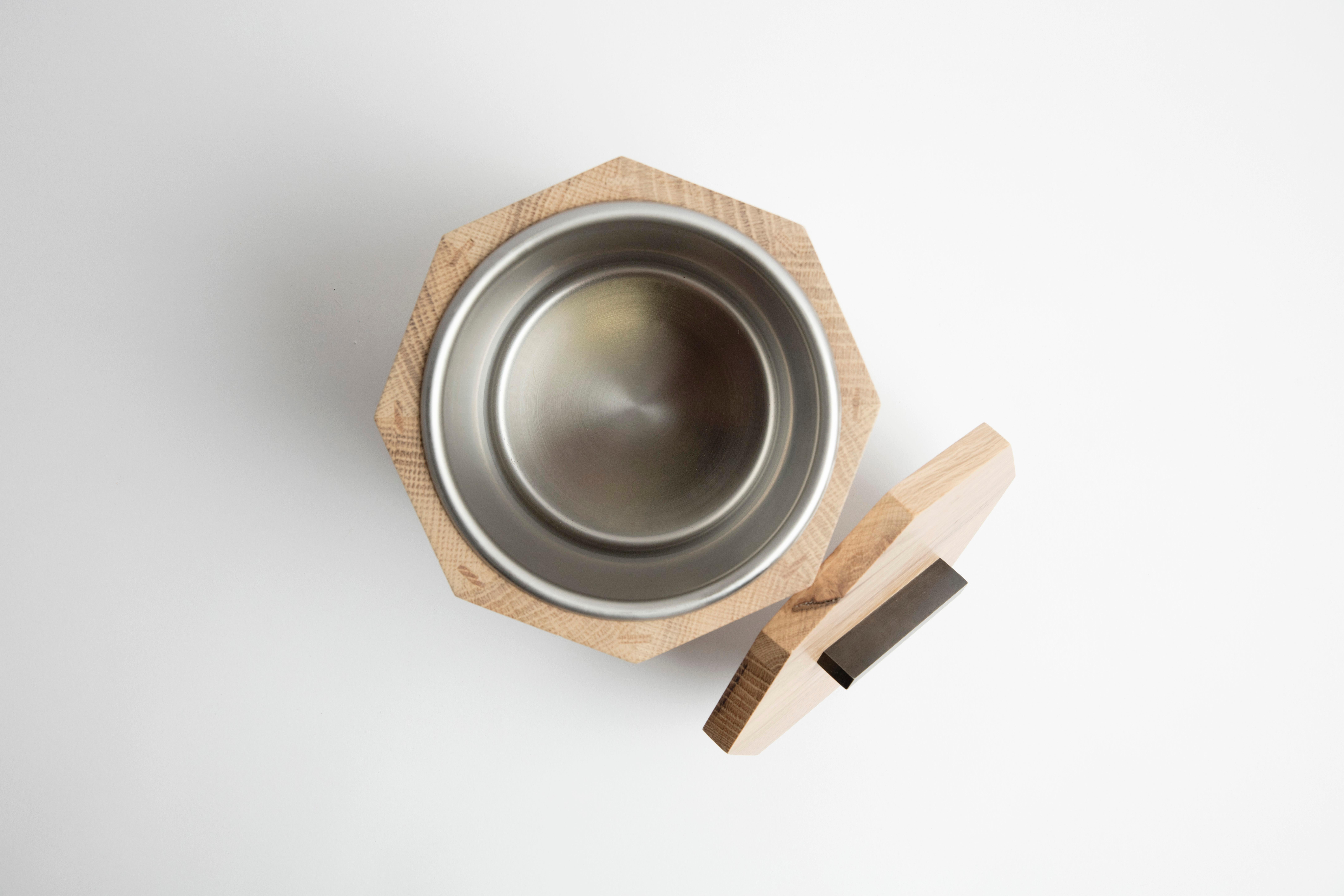 Our solid wood ice bucket is hand-crafted with solid white oak from Birmingham's urban forest. Modern geometric barware strikes a clean line on your counter. Store ice for cocktails or keep a bottle of your favorite white wine cool and crisp for
