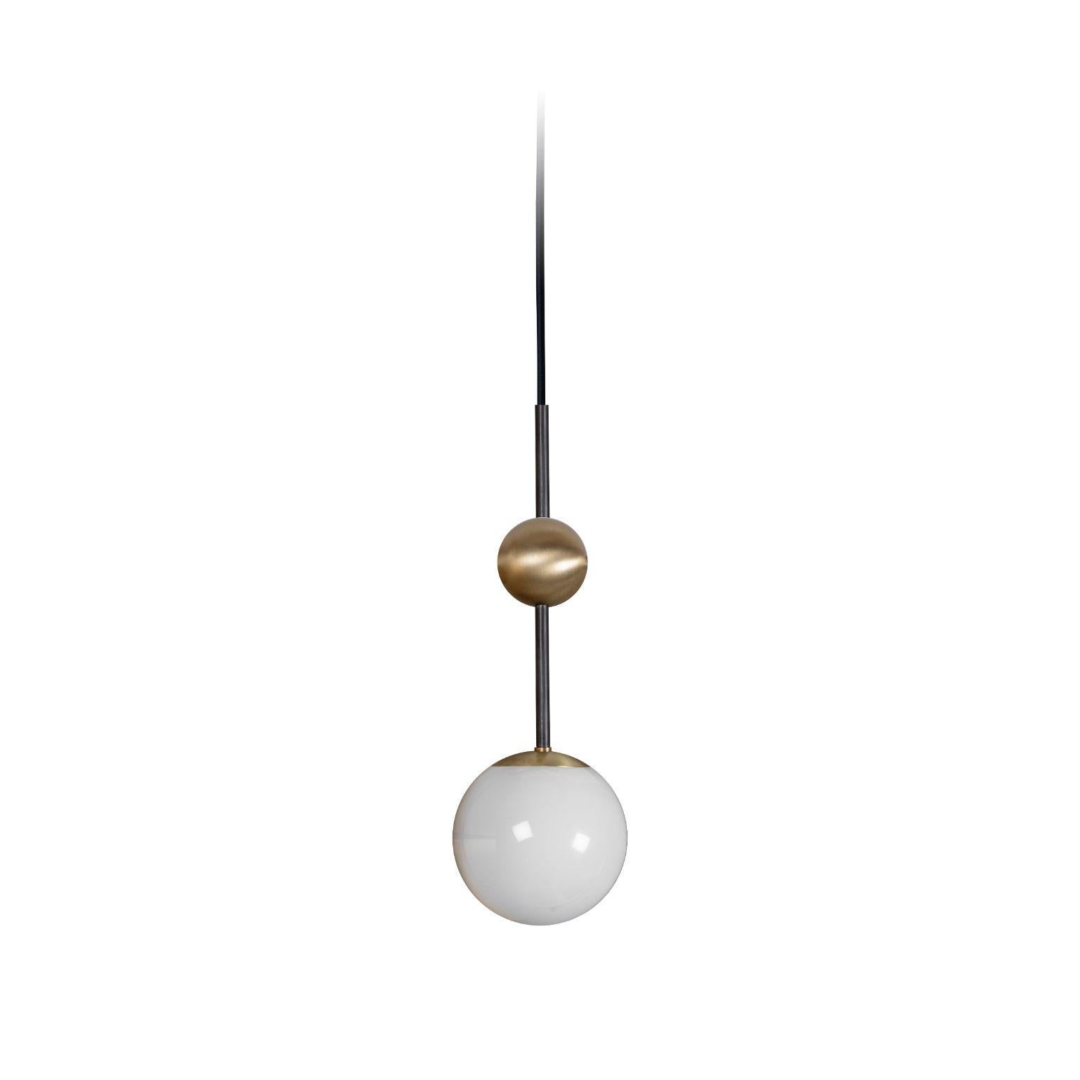 Rift pendant light by Bert Frank
Dimensions: 36.5 x 12.5 cm
Materials: Brushed brass, dark bronze detail, opal glass

When Adam Yeats and Robbie Llewellyn founded Bert Frank in 2013 it was a meeting of minds and the start of a collaborative