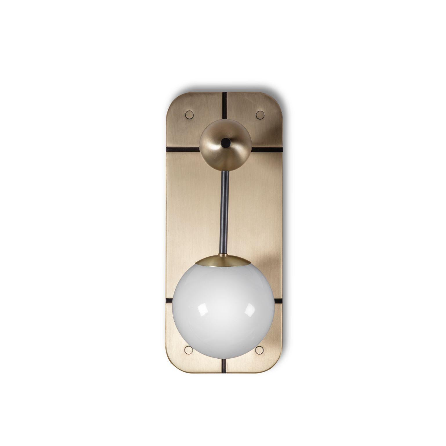 Rift wall light by Bert Frank
Dimensions: 36 x 15 x 15.5 cm
Materials: Brushed brass, dark bronze detail, opal glass

When Adam Yeats and Robbie Llewellyn founded Bert Frank in 2013 it was a meeting of minds and the start of a collaborative