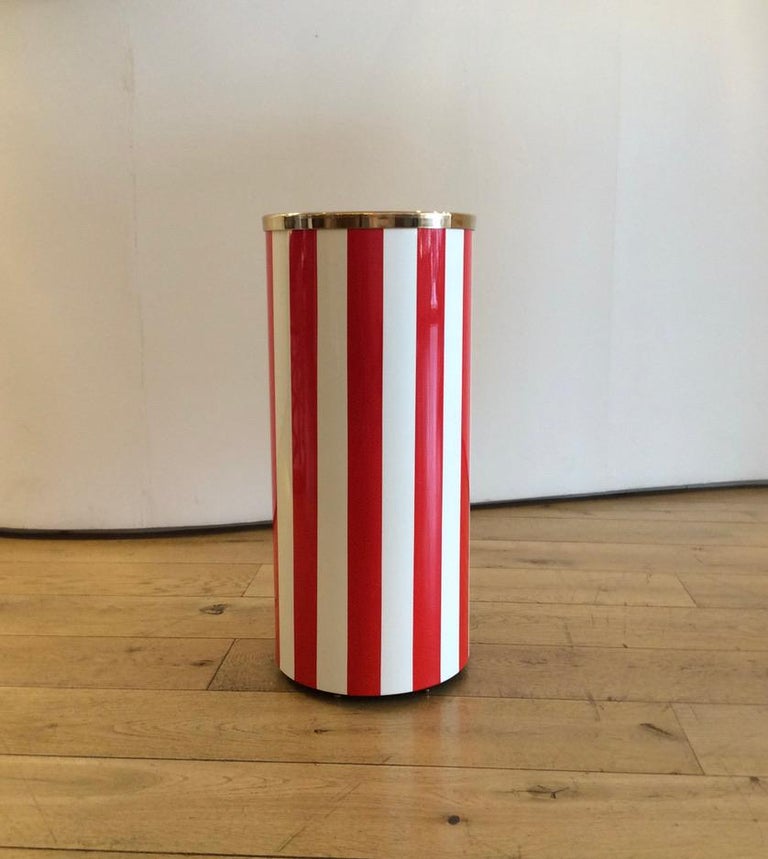 Hand coloured transfer printed red and white stripe pattern on metal, with brass top rim
With Fornasetti marks and hand numbered and dated 'N 1 / 2018'.


  
