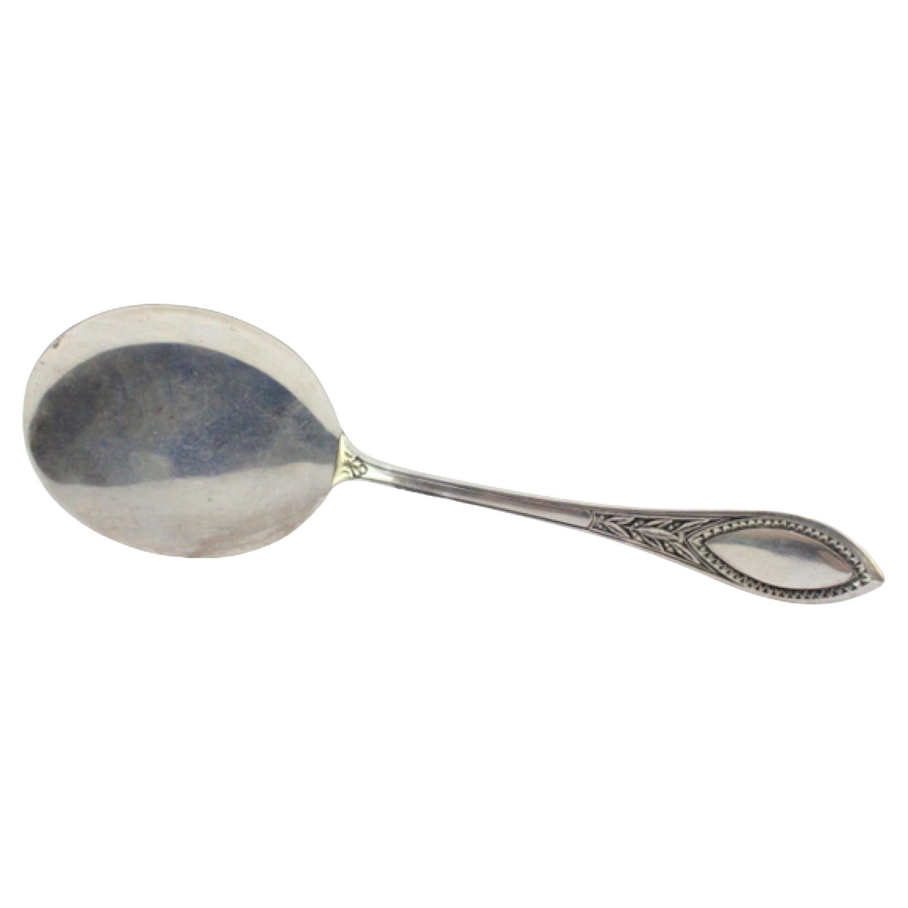 Right-handed silver ice cream scoop with grooved handle and monogram en venta