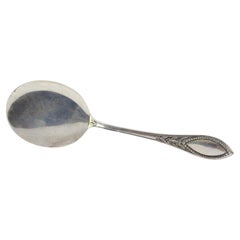 Right-handed silver ice cream scoop with grooved handle and monogram