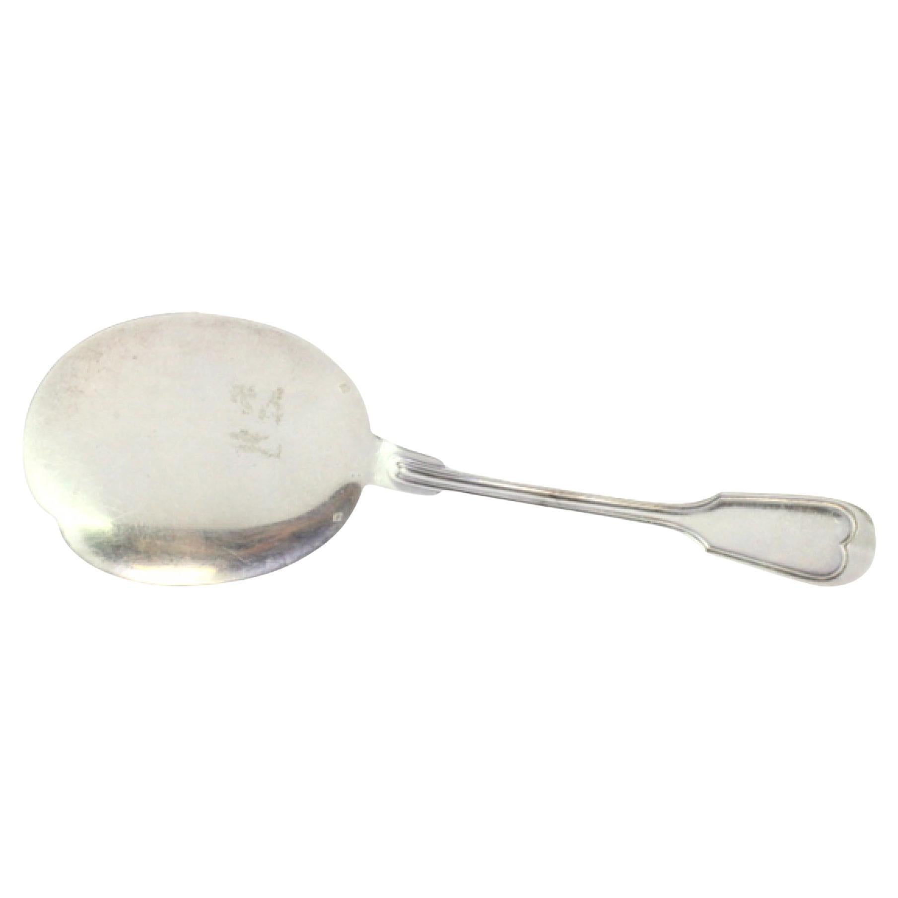Right-handed silver ice cream scoop with grooves along the handle
