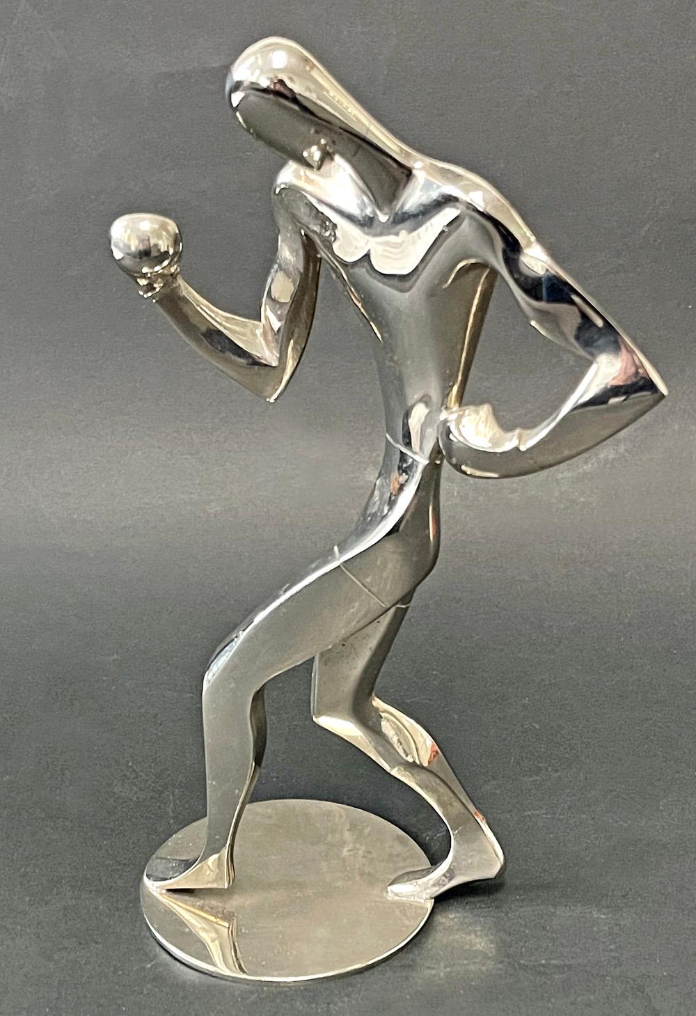 Sculpted by one of the greatest innovators in Art Deco sculpture in 1930s Europe, this nickeled brass figure of a boxer, his right arm reaching out to jab at his opponent, was made by the Hagenauer firm in Vienna. Hagenauer made an enormous array of