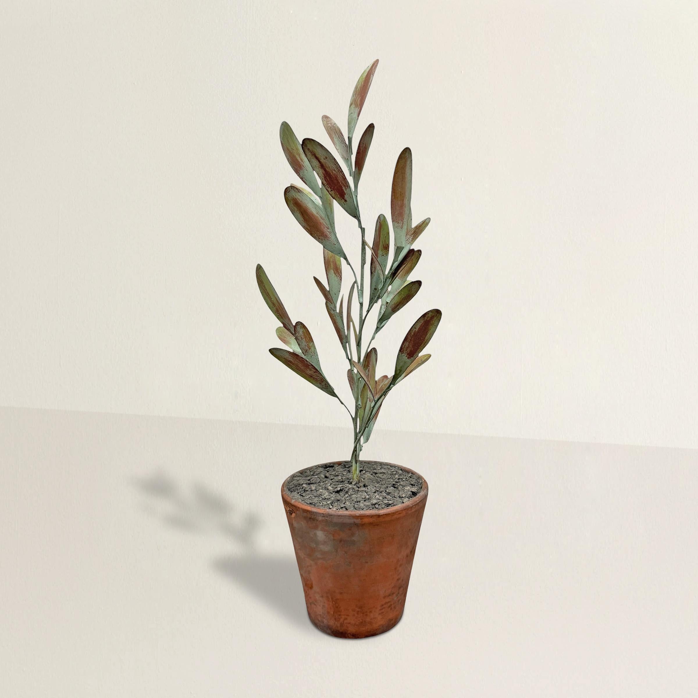 Hand-crafted by RIGHT PROPER artisans in small batches, this tole olive topiary is inspired by famed garden enthusiast Bunny Mellon and her passion for topiary cultivation. Made from meticulously shaped metal branches, each leaf is hand-painted to