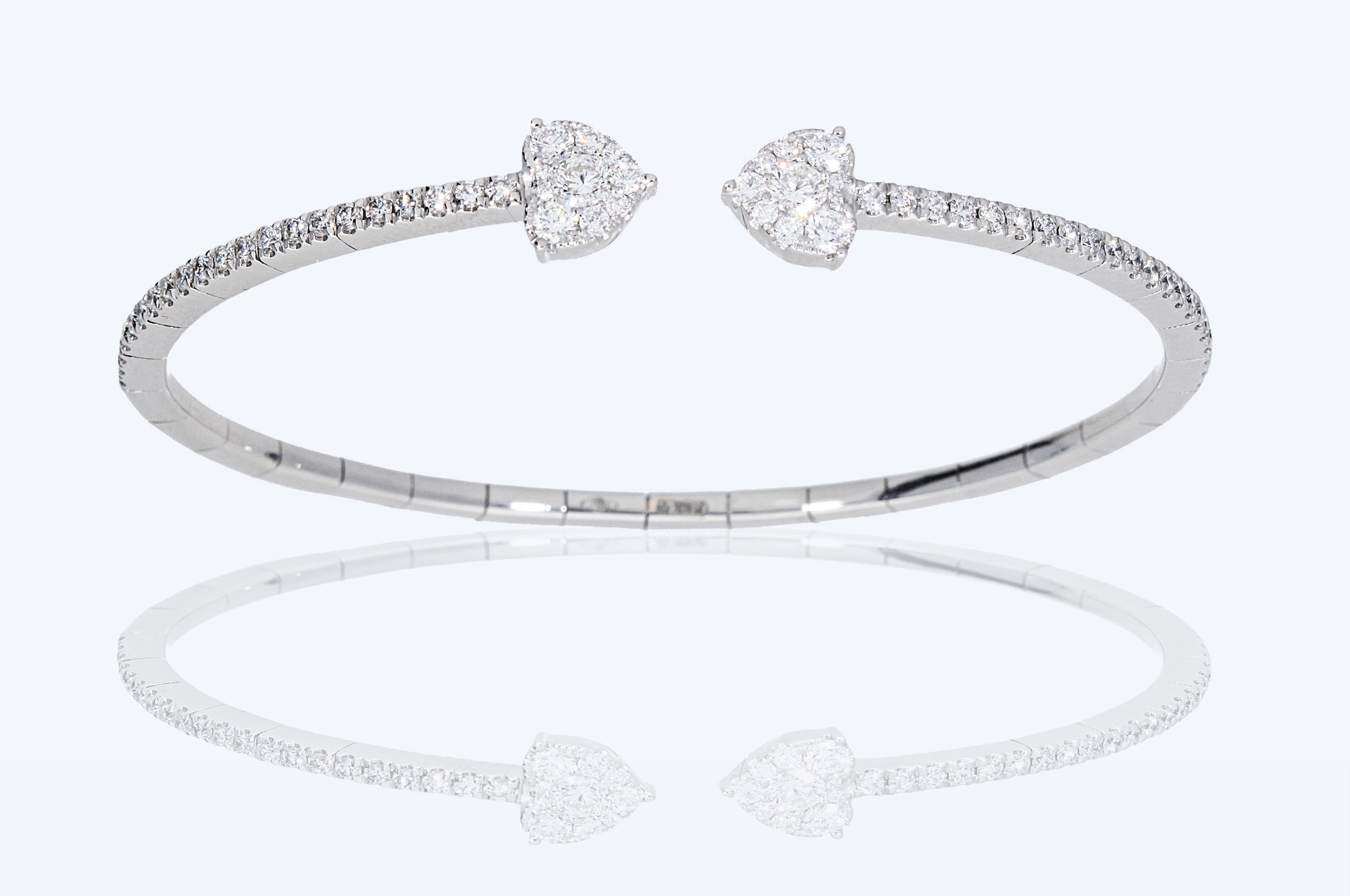 Rigid spring bracelet, with heart-shaped ends. 
The bracelet is made up of a row of diamonds with a final heart with pavé diamonds.
The total carat weight of the diamonds is 1.14 ct.
The bracelet is in 18 Kt white gold

•THE MANUFACTURE IS MADE IN