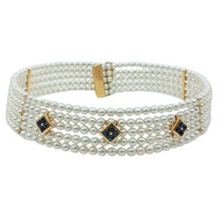 Rigid yellow gold choker with pearls